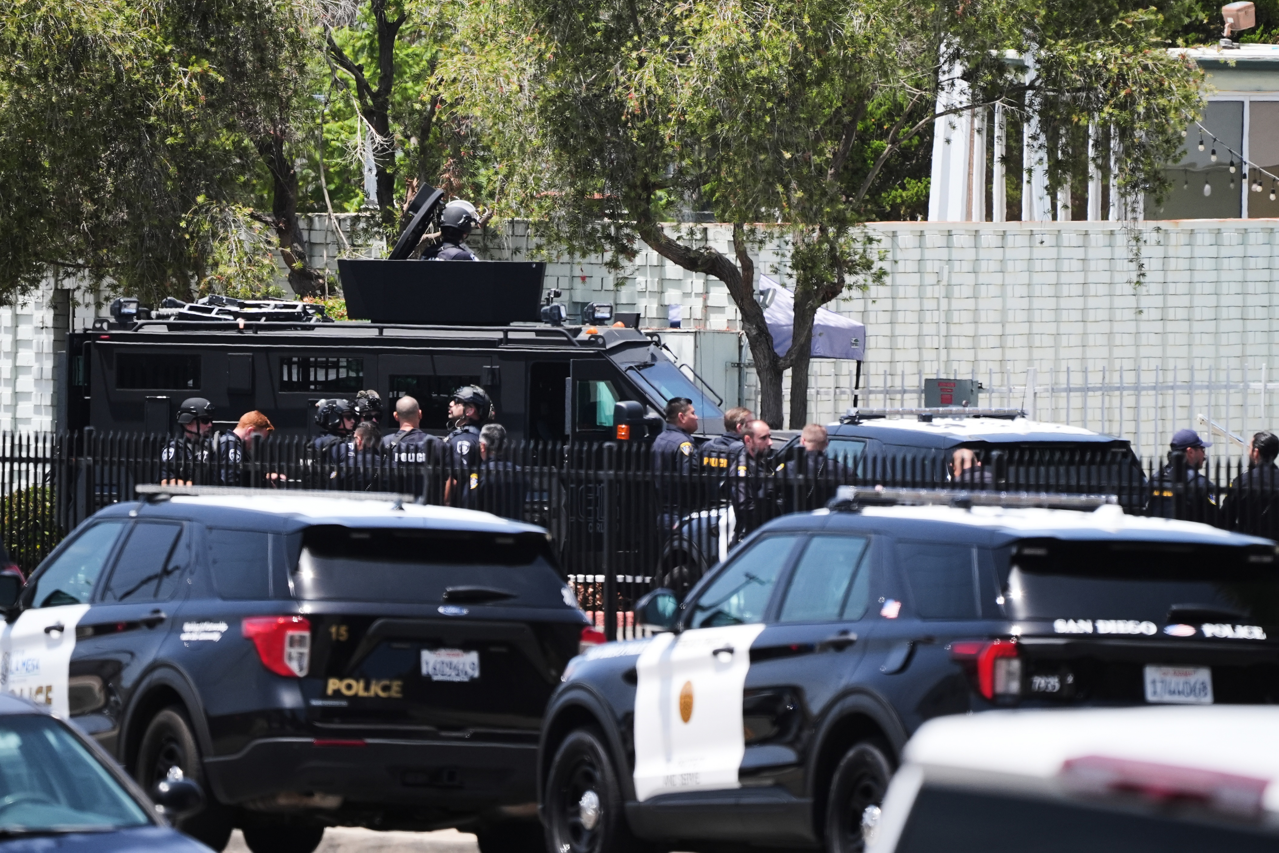 Police stage at the scene of a shooting outside the Islamic Center of San Diego Monday, May 18, 2026, in San Diego.