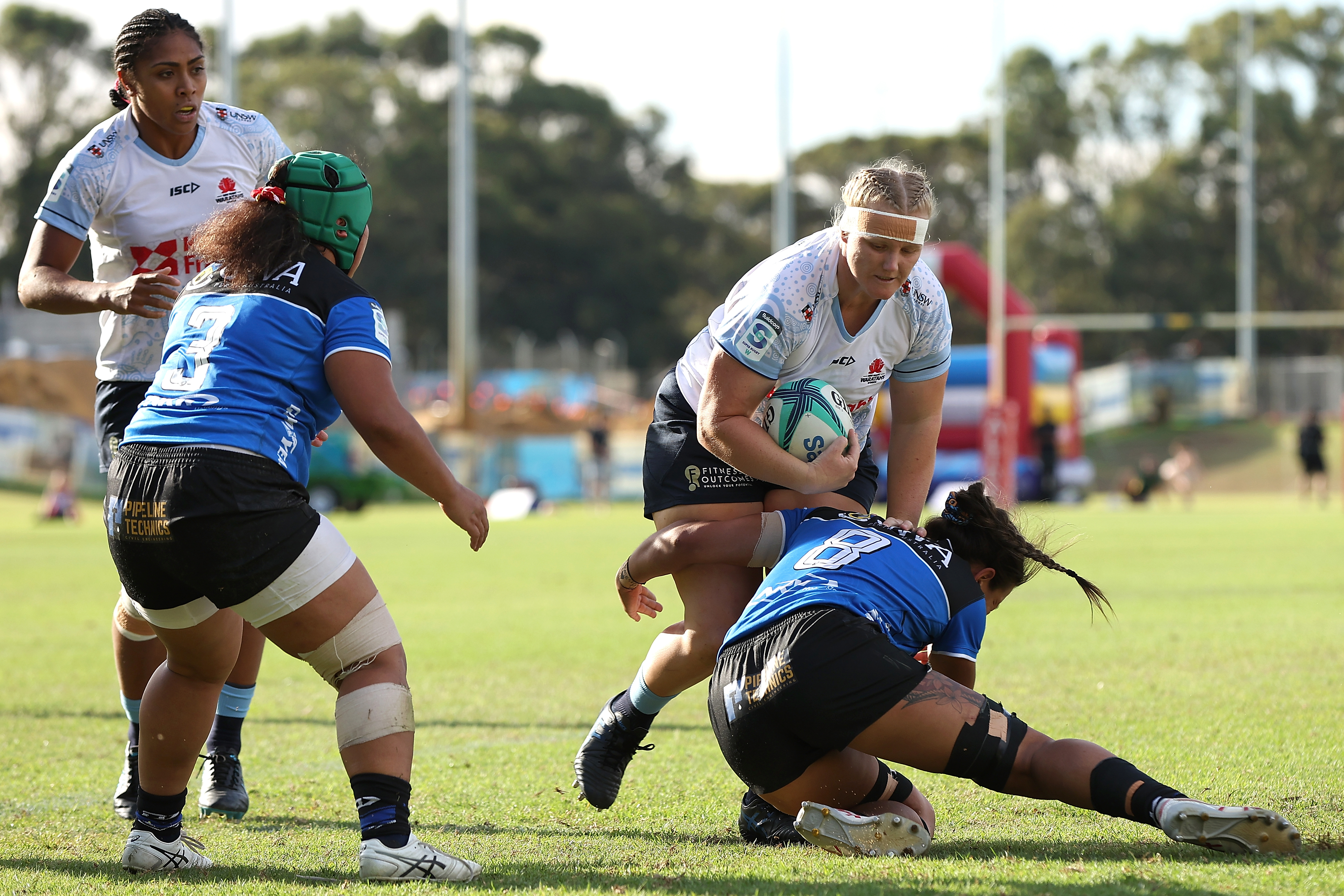 Emily Robinson is tackled by Tamika Jones during the round four Super Rugby Women's match between the Western Force and the NSW Waratahs.