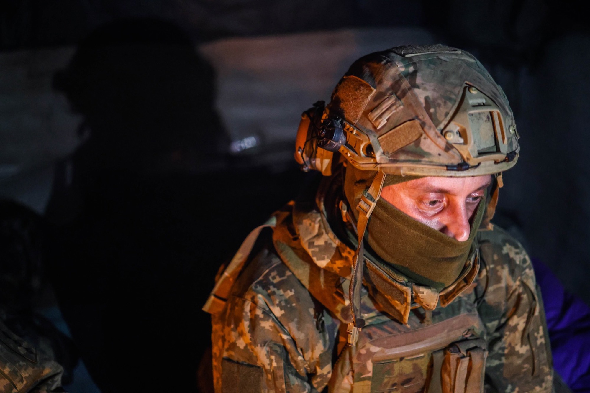 Andriy and others in his unit shelter in a bunker southwest of Bakhmut, in eastern Ukraine, on January 31.