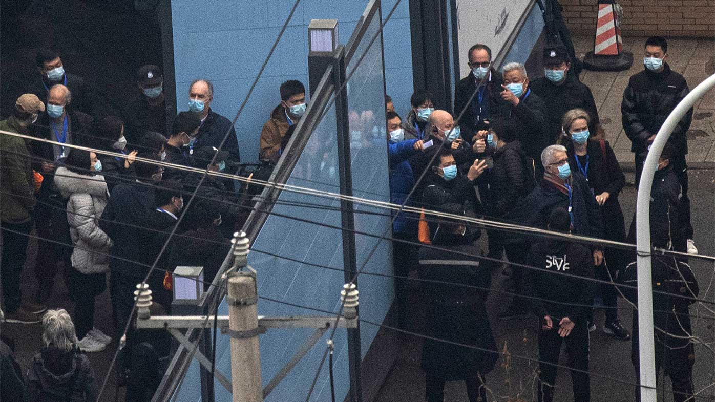 Investigative team members of the World Health Organisation are seen visiting a Huanan seafood market in Wuhan.