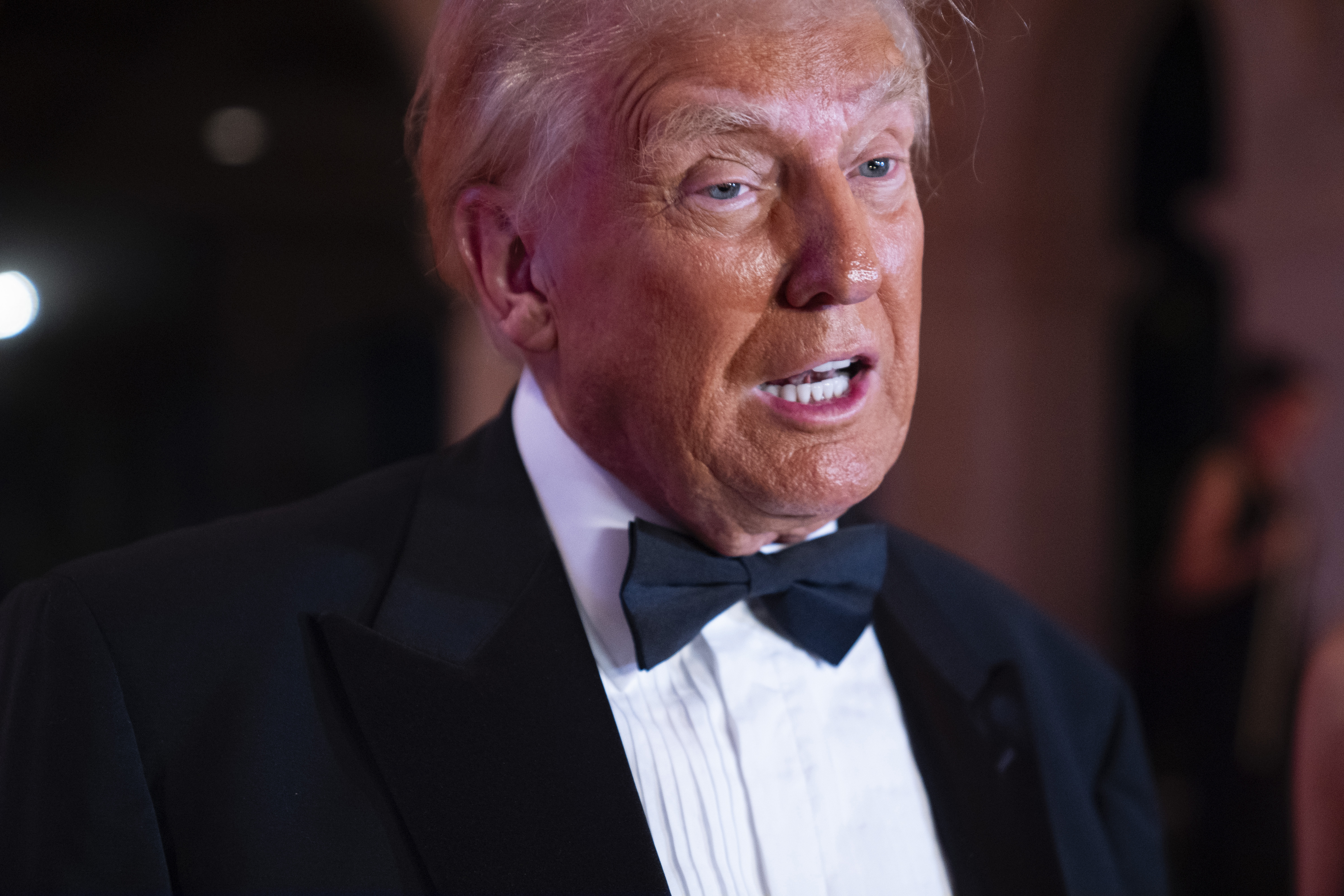 President-elect Donald Trump speaks to reporters before a New Year's Eve party at Mar-a-Lago, Tuesday, Dec. 31, 2024, in Palm Beach, Fla. (AP Photo/Evan Vucci)