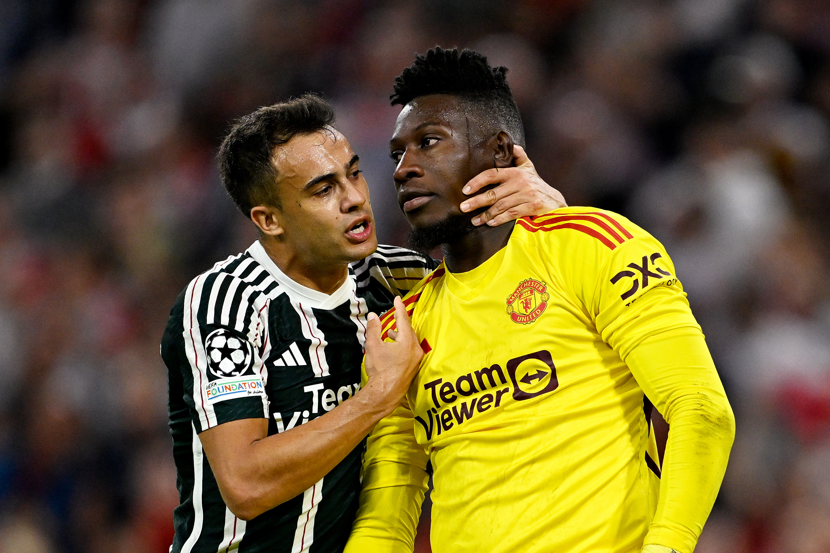 MUNICH, GERMANY - SEPTEMBER 20: Sergio Reguilon and Andre Onana of Manchester United interact during the UEFA Champions League match between FC Bayern München and Manchester United at Allianz Arena on September 20, 2023 in Munich, Germany. (Photo by Daniel Kopatsch - UEFA/UEFA via Getty Images)