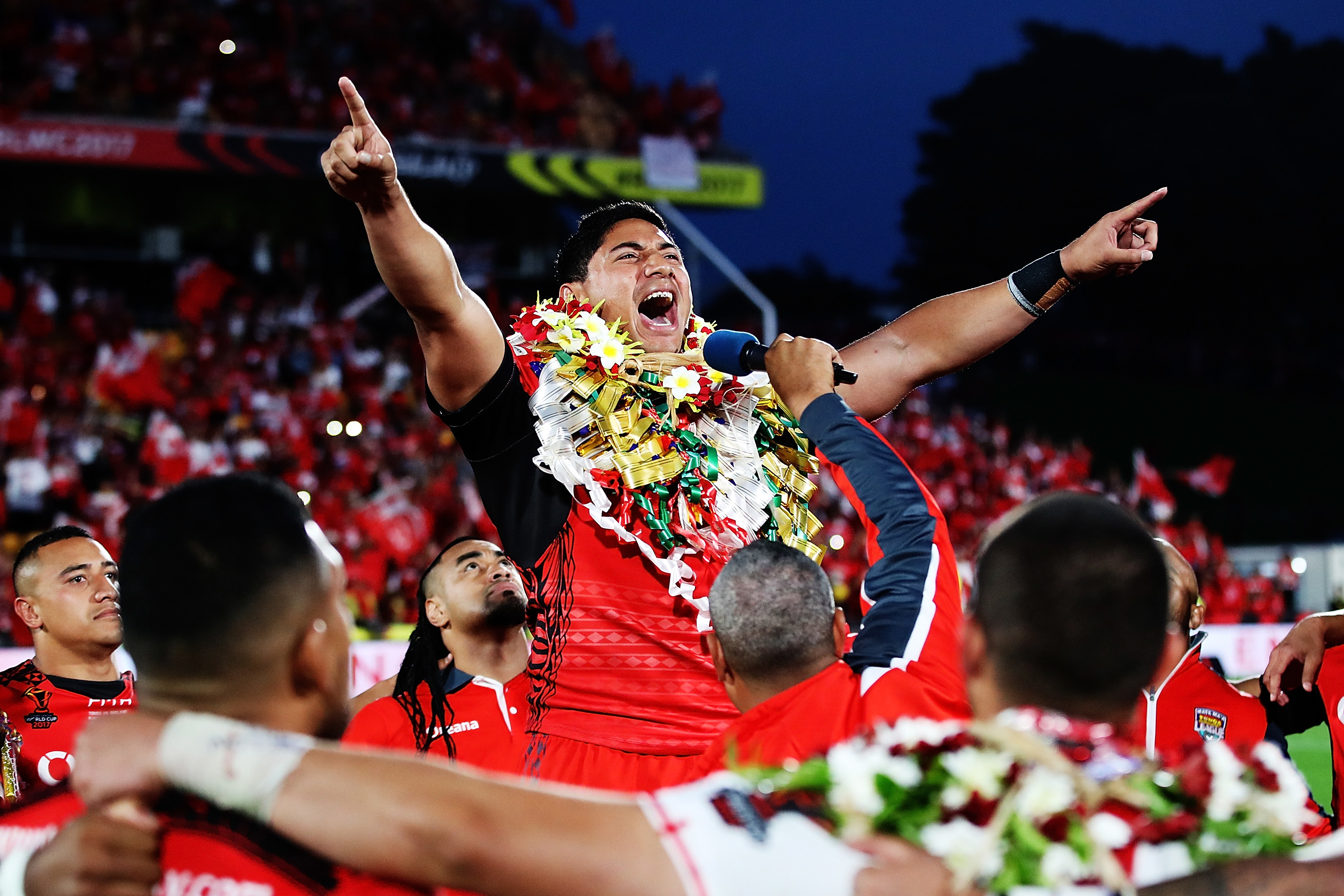 Jason Taumalolo of Tonga leads the Sipi Tau for the crowd.