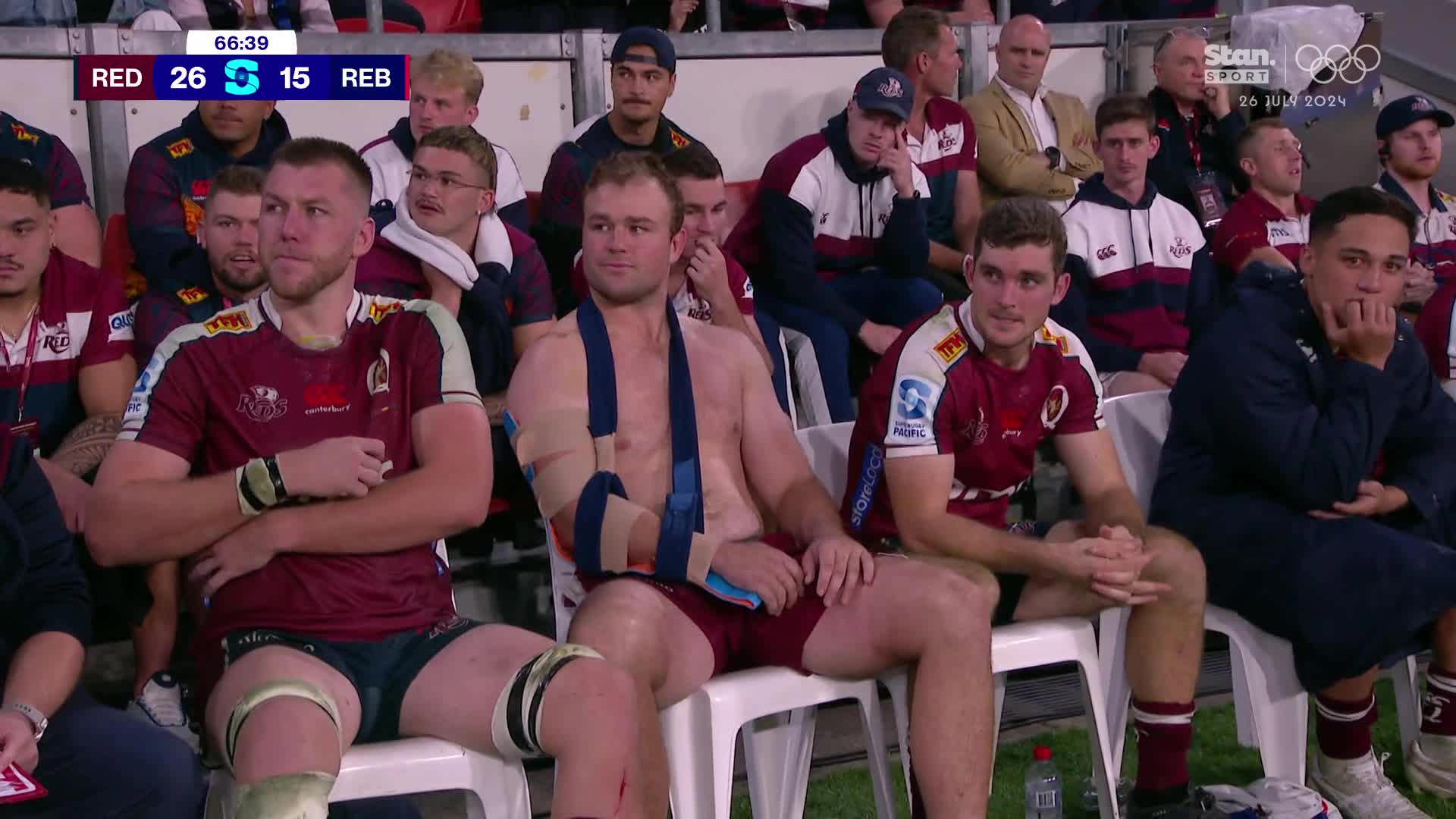 Reds No.8 Harry Wilson (middle) sporting an arm brace.