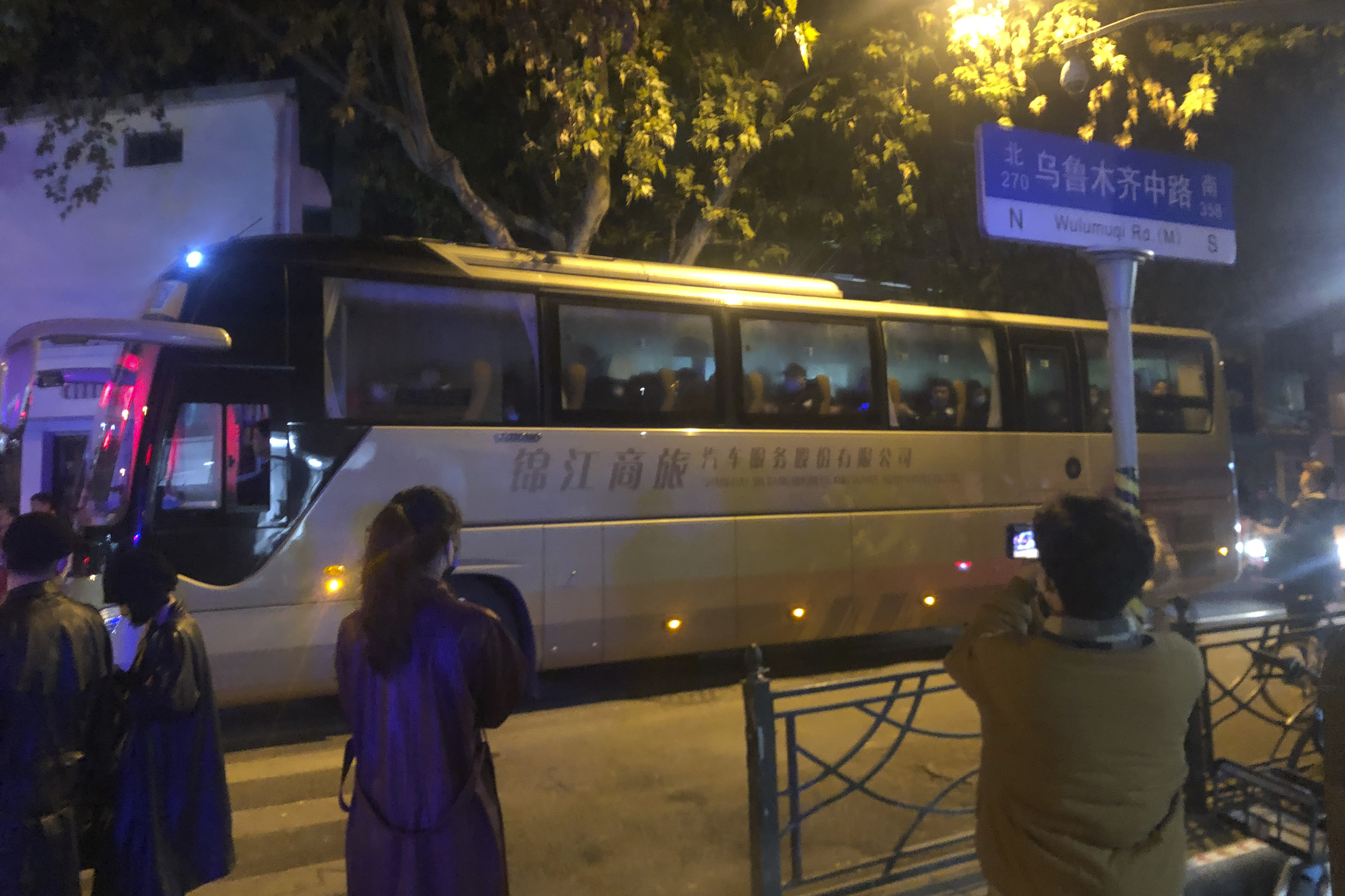 In this photo obtained by The Associated Press, protesters are taken away by police in a bus in Shanghai on Saturday, Nov. 26, 2022. Protests against Chinas restrictive COVID measures appeared in a number of cities Saturday night, in displays of public defiance fanned by anger over a deadly fire in the western Xinjiang region.