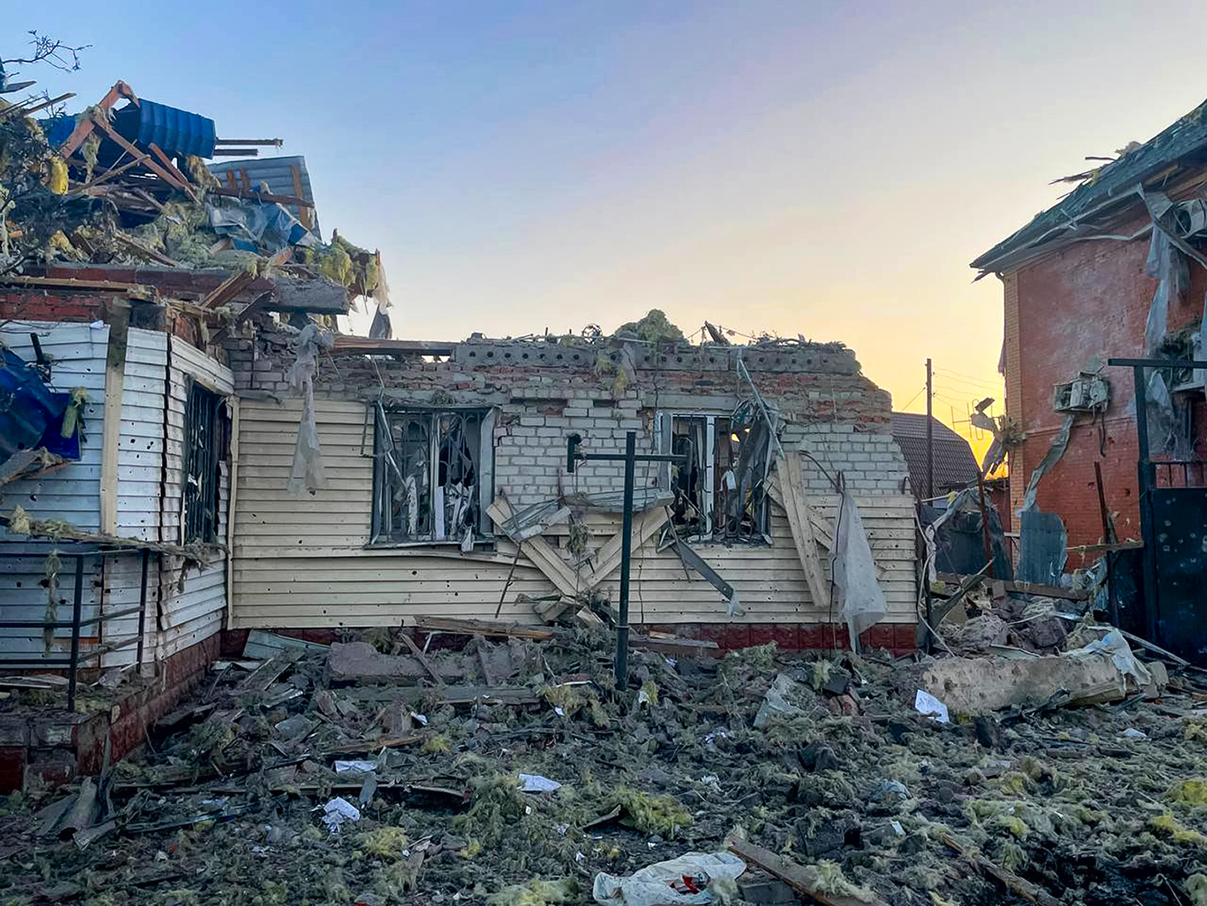 damaged house after shelling by the Ukrainian side in the city of Sudzha, Kursk region that borders Ukraine, Tuesday, Aug. 6, 2024. 