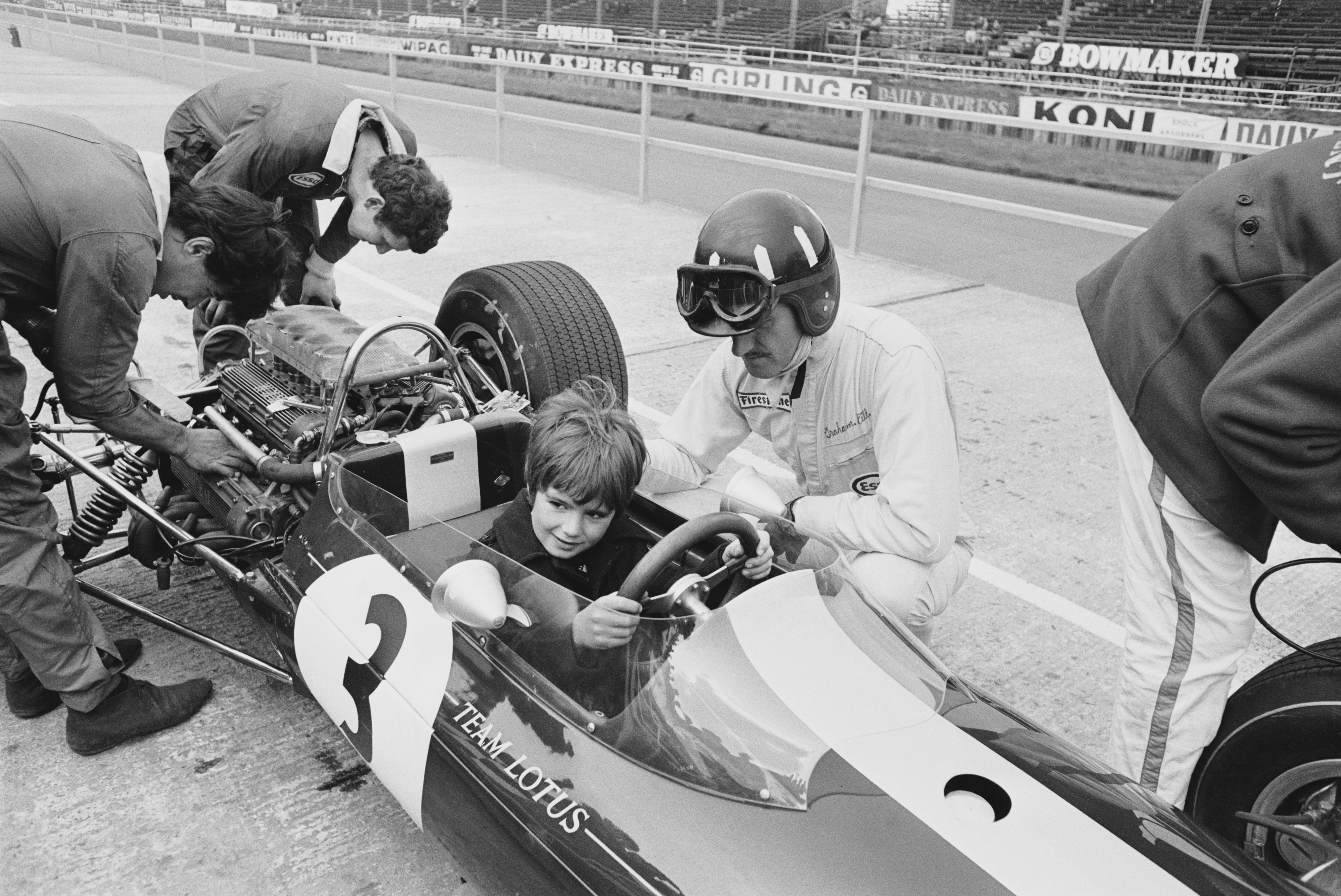 British racing driver Graham Hill overseeing his son Damon in 1967.