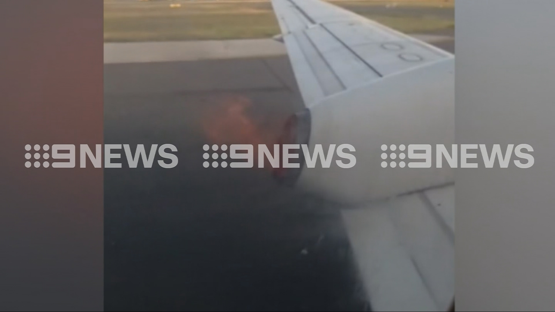 Passengers look out window to see plane on fire as it accelerates down runway 