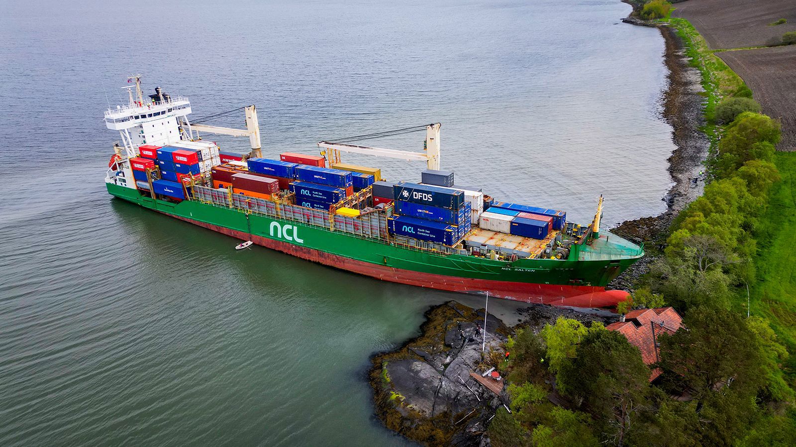 This aerial view shows the 443-foot NCL Salten grounded in the Trondheim Fjord.