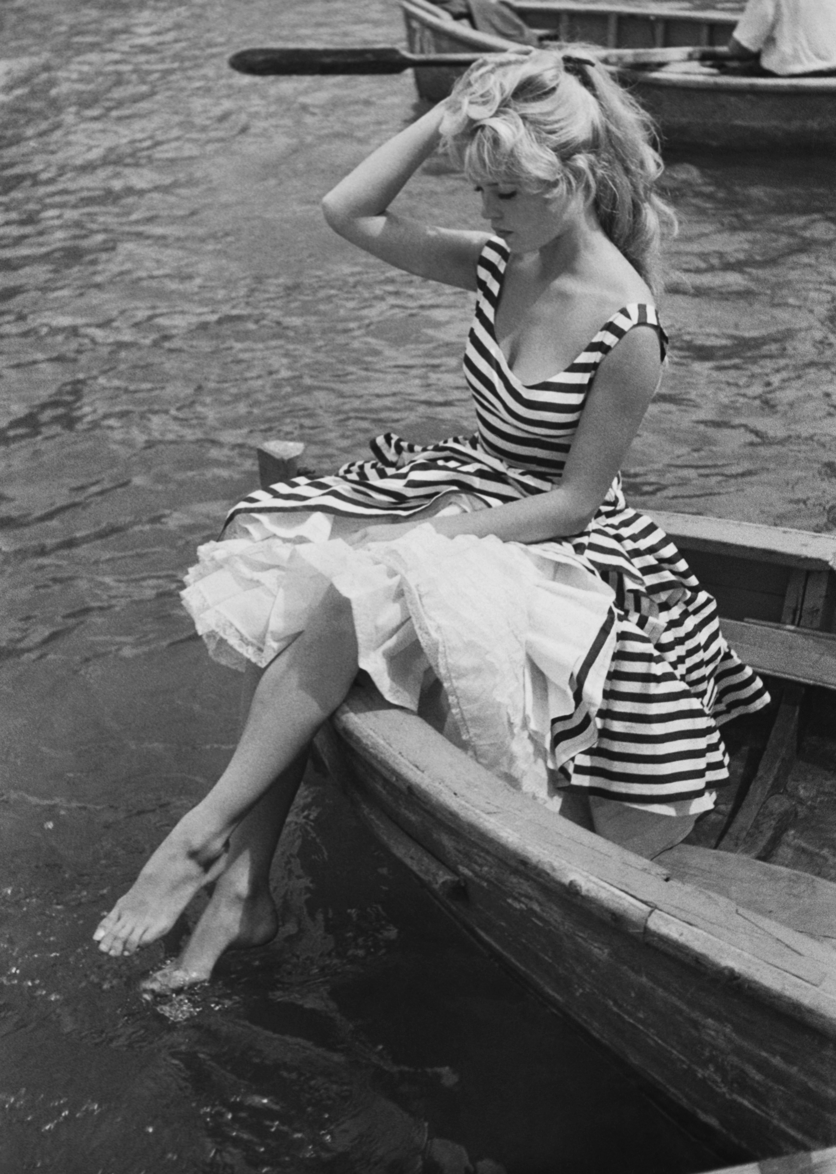 Brigitte Bardot, in a striped dress, in the 1950s. 