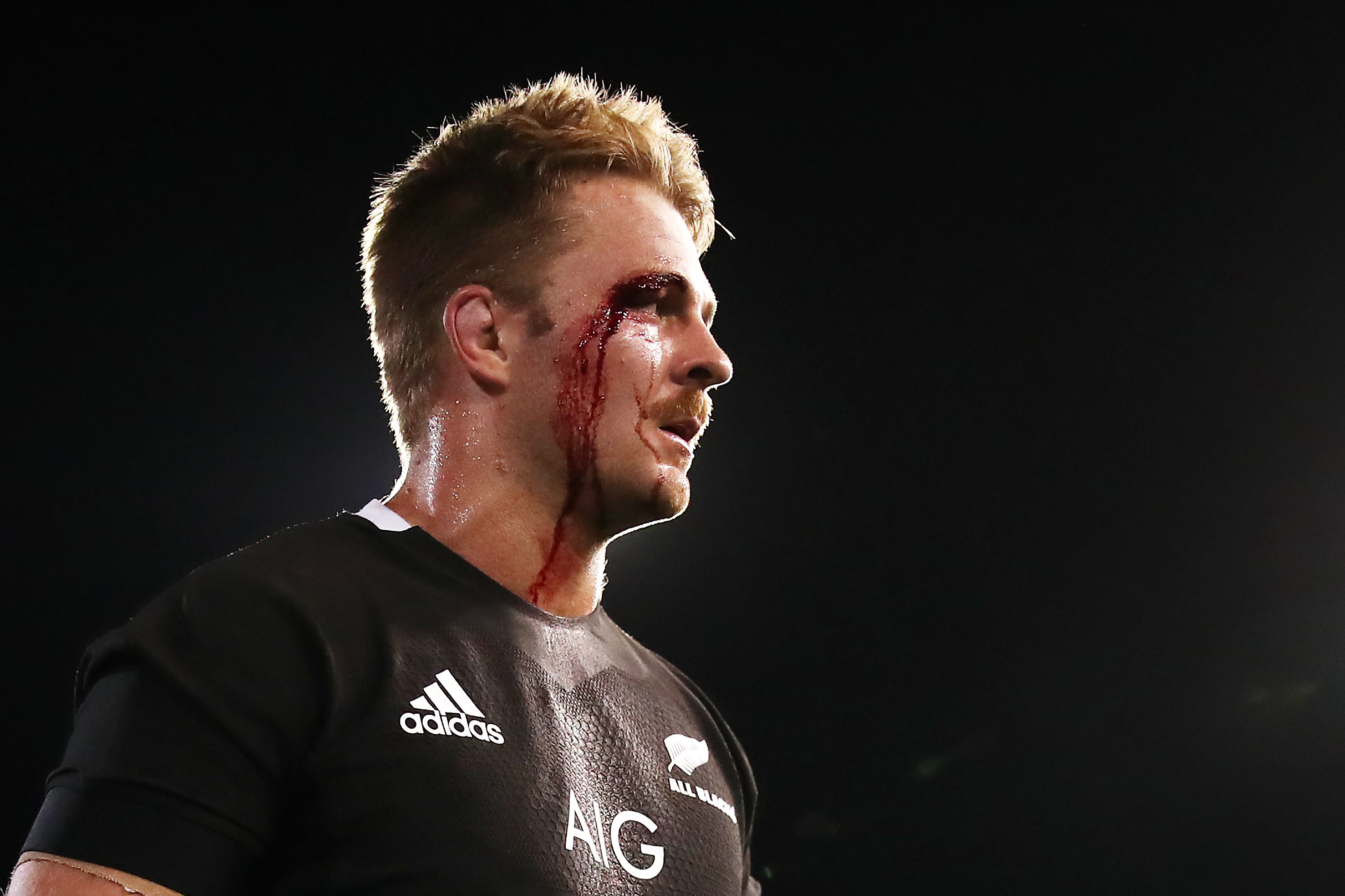 Sam Cane of the All Blacks walks off the field after winning.