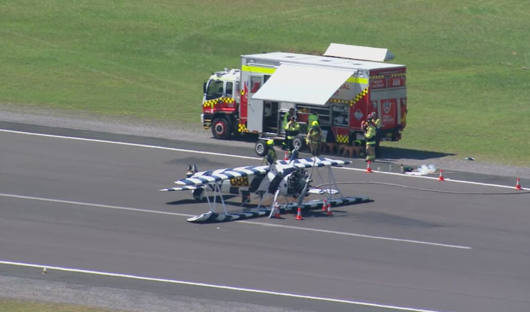 A vintage biplane has crashed at a New South Wales airport, landing upside down on the runway while attempting to touch down.