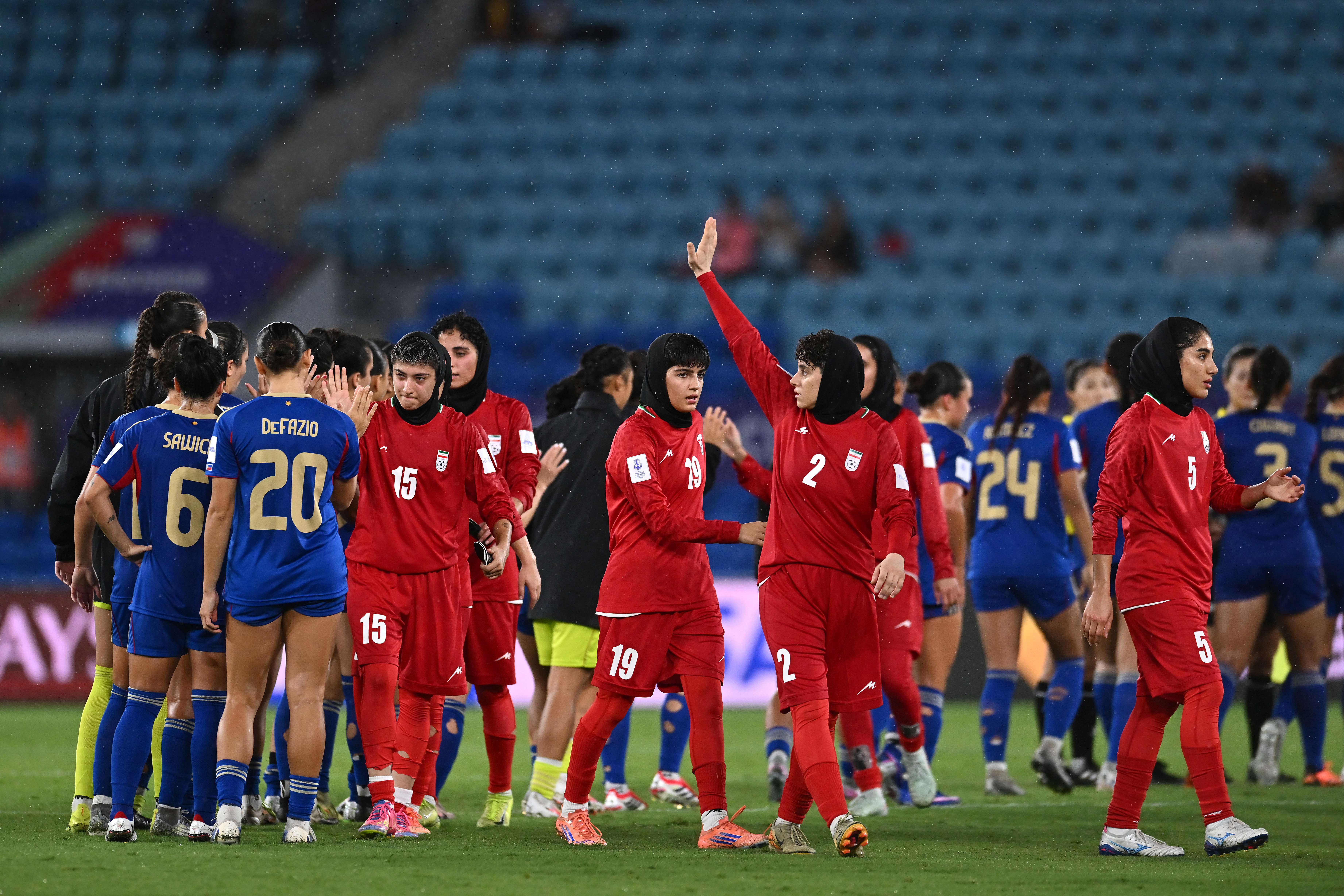 Atefeh Imani of Islamic Republic of Iran waves to fans in the stand.