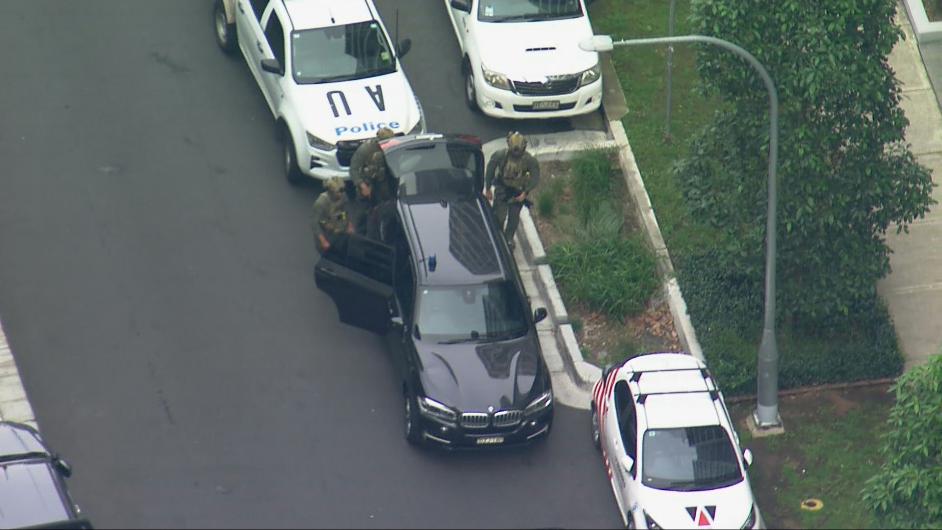 Multiple police units, including tactical officers, are on site at Lidcombe.