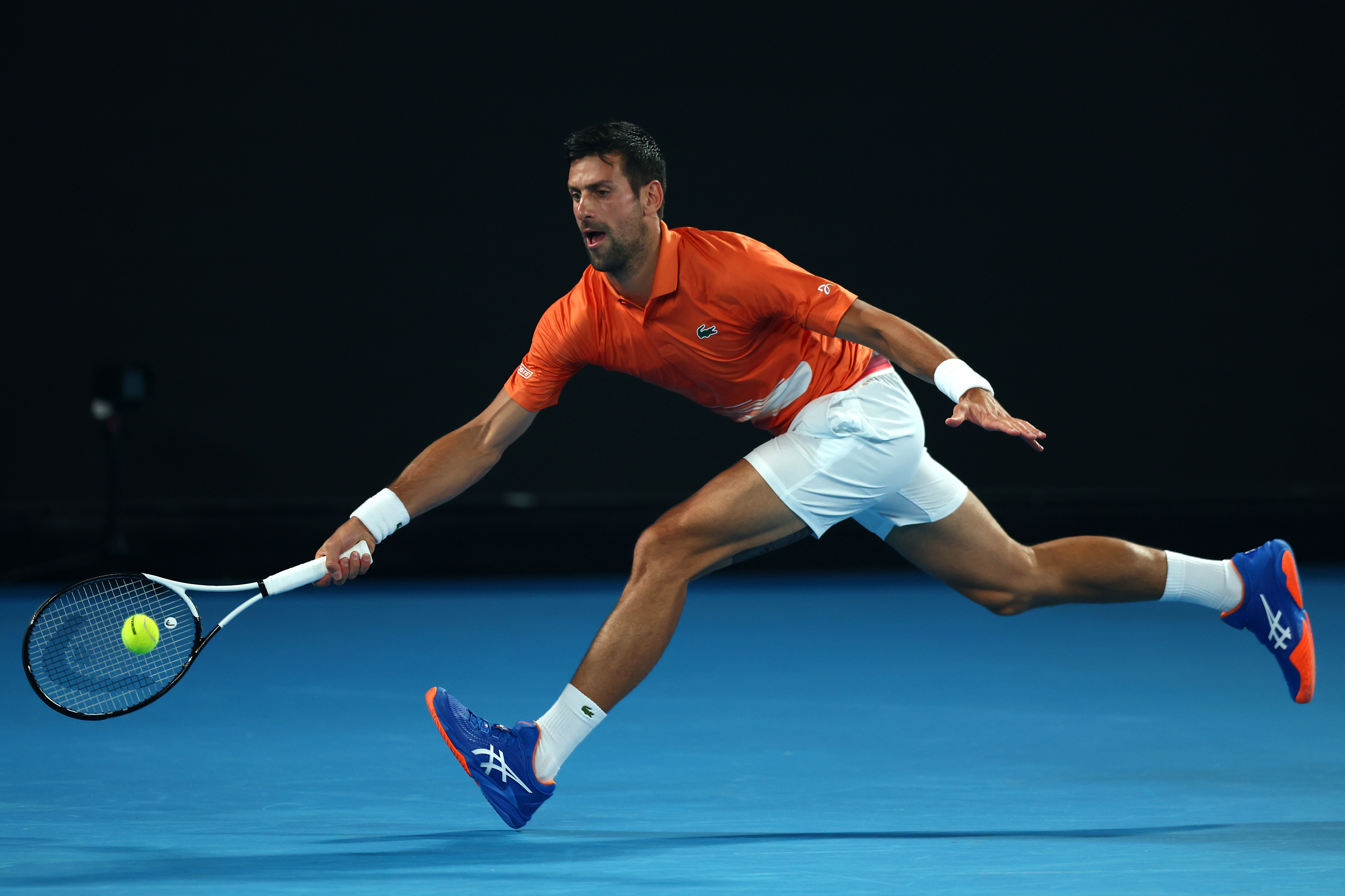 MELBOURNE, AUSTRALIA - JANUARY 13: Novak Djokovic of Serbia plays a forehand in his Arena Showdown charity match against Nick Kyrgios of Australia ahead of the 2023 Australian Open at Melbourne Park on January 13, 2023 in Melbourne, Australia. (Photo by Graham Denholm/Getty Images)
