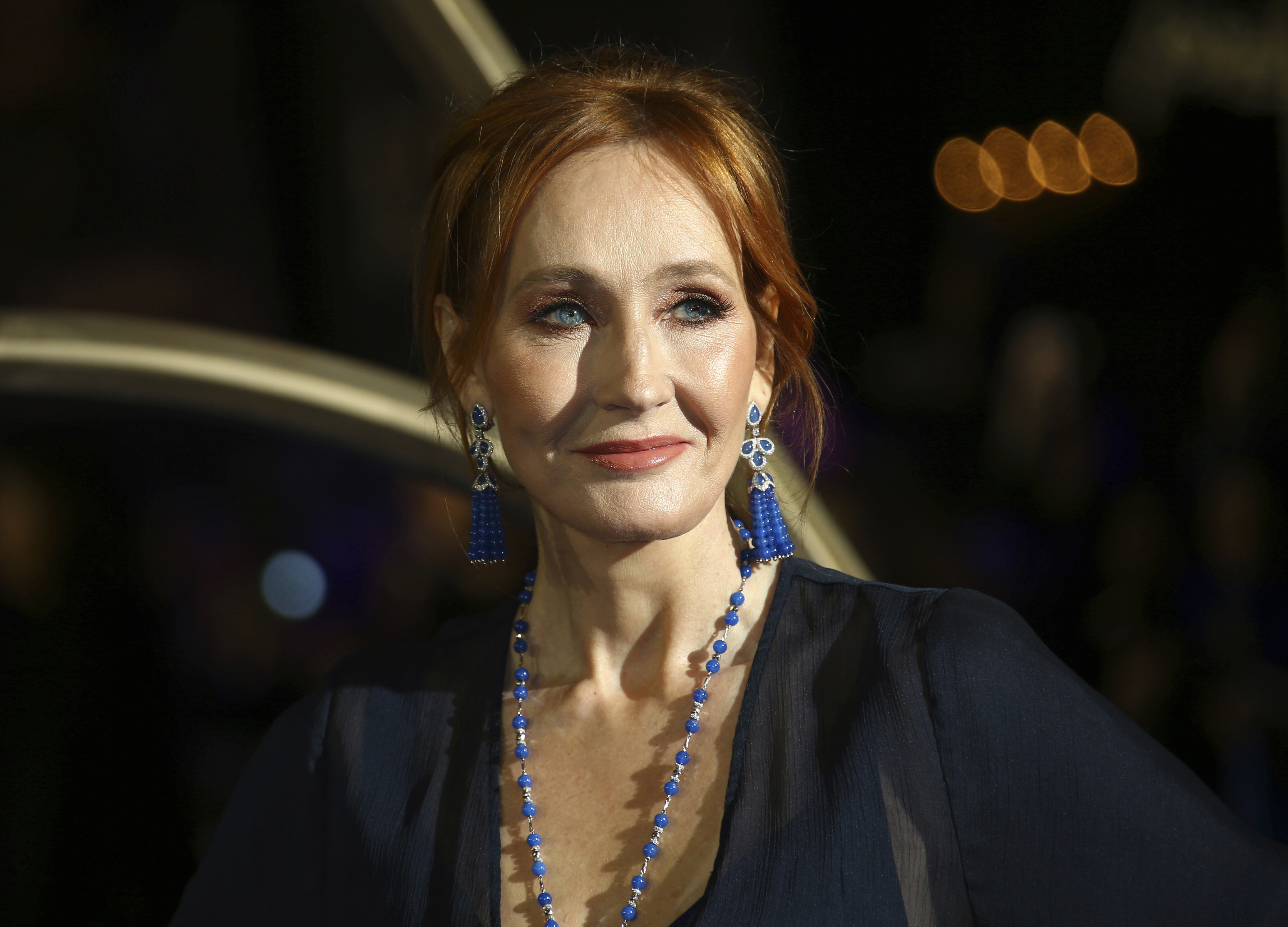 J.K. Rowling poses for photographers upon her arrival at the premiere of the film 'Fantastic Beasts: The Crimes of Grindelwald', in London, Nov. 13, 2018. 