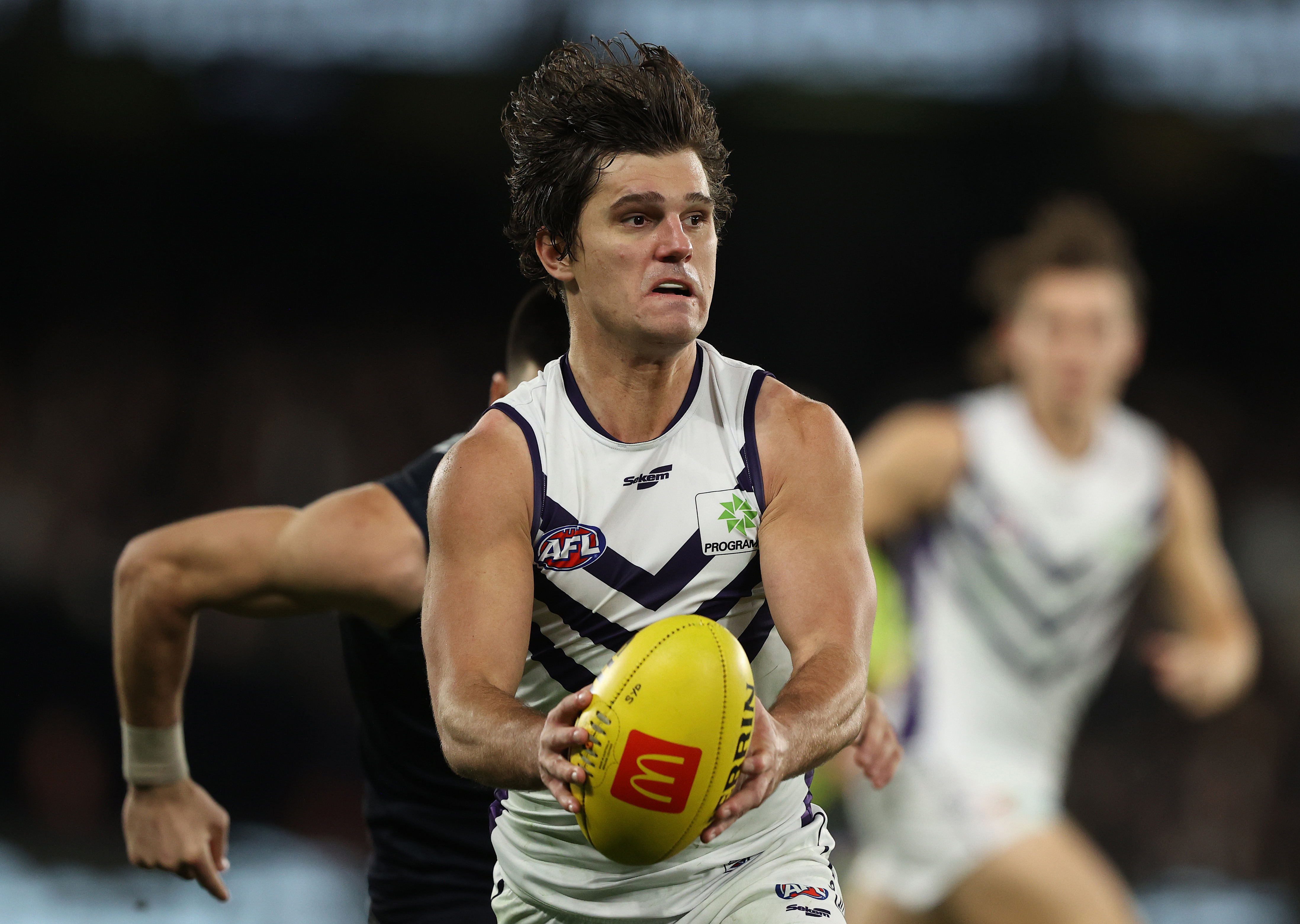MELBOURNE, AUSTRALIA - JUNE 25: Lachie Schultz of the Dockers runs with the ball during the round 15 AFL match between the Carlton Blues and the Fremantle Dockers at Marvel Stadium on June 25, 2022 in Melbourne, Australia. (Photo by Robert Cianflone/Getty Images)