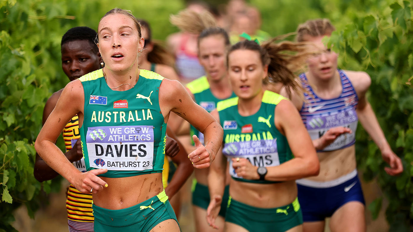 Rose Davies running through a vineyard at the 2023 World Cross Country Championships in Bathurst.