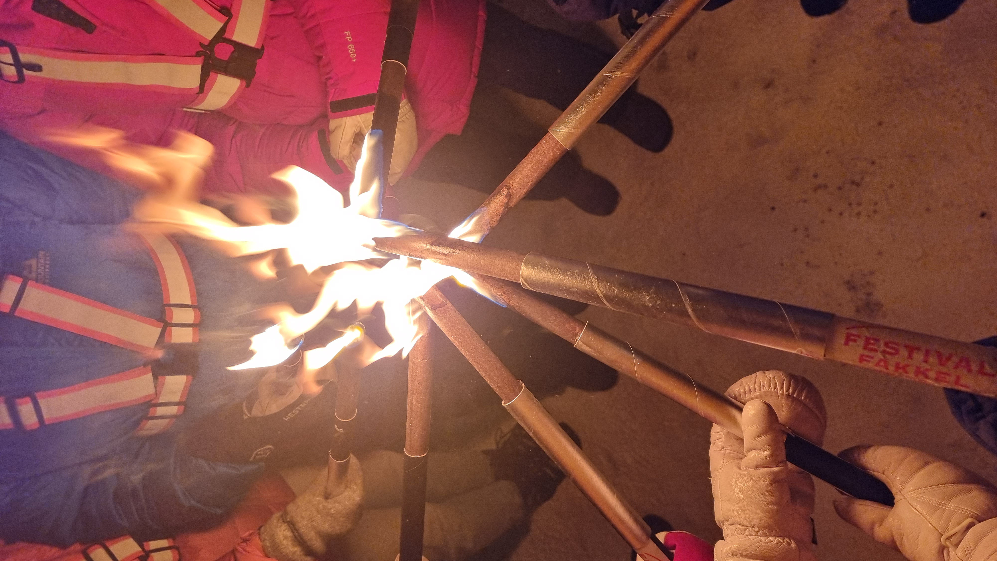 People light torches for a procession on the first day of Advent. 