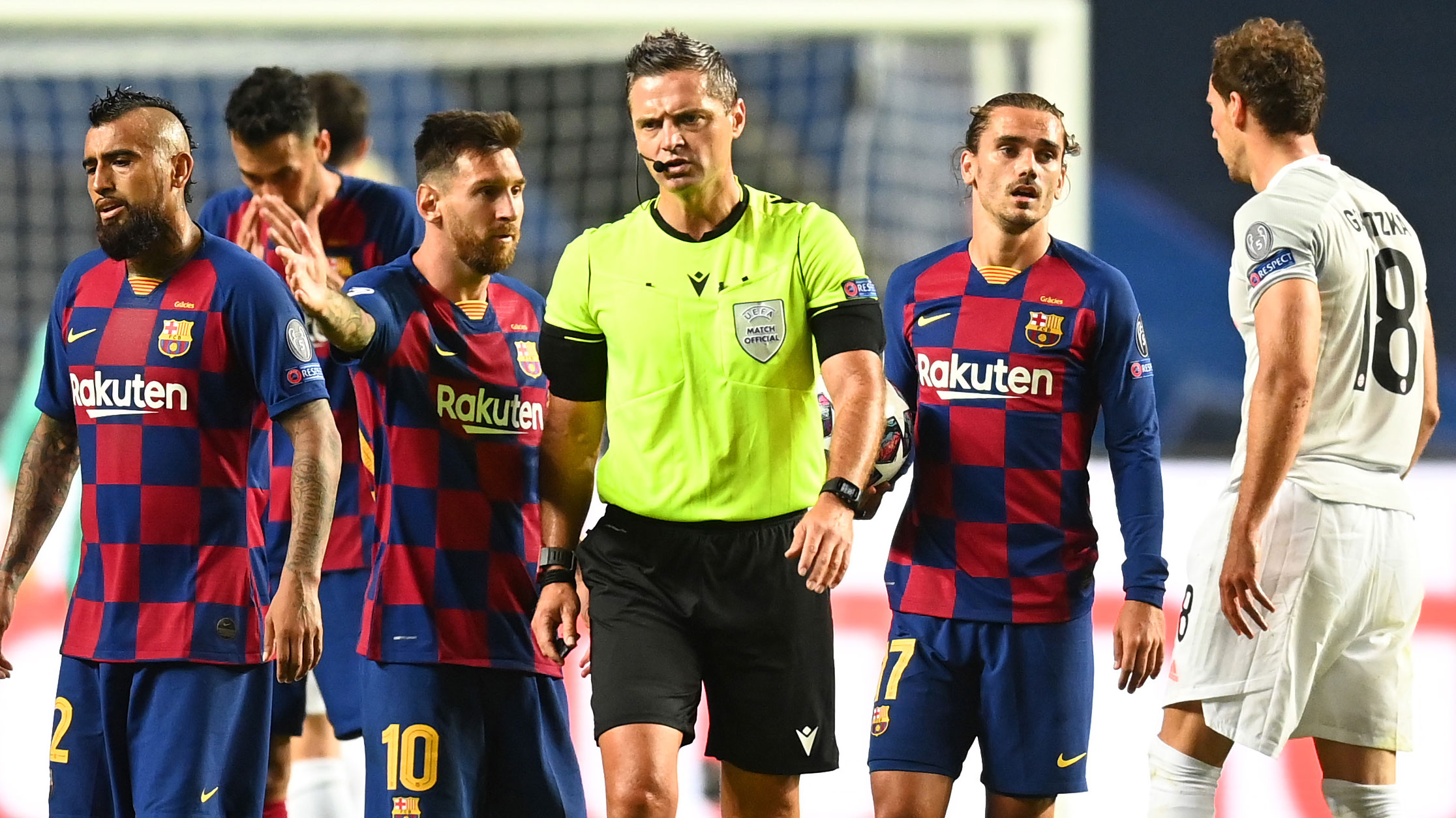 Lionel Messi of FC Barcelona confronts referee Damir Skomina during the UEFA Champions League Quarter Final match between Barcelona and Bayern Munich. 