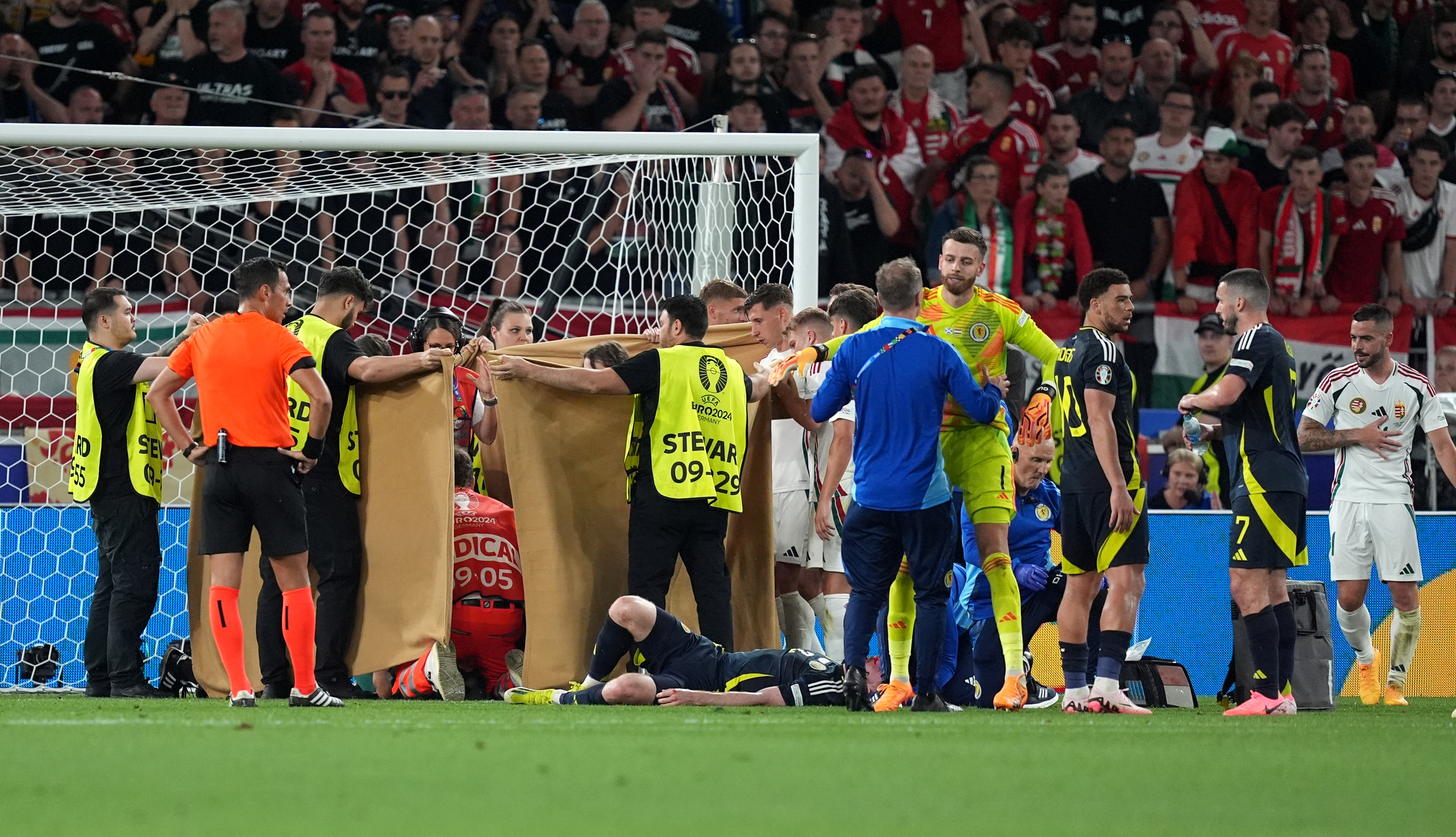 Hungary's Barnabas Varga receives treatment following a collision during the Euros.