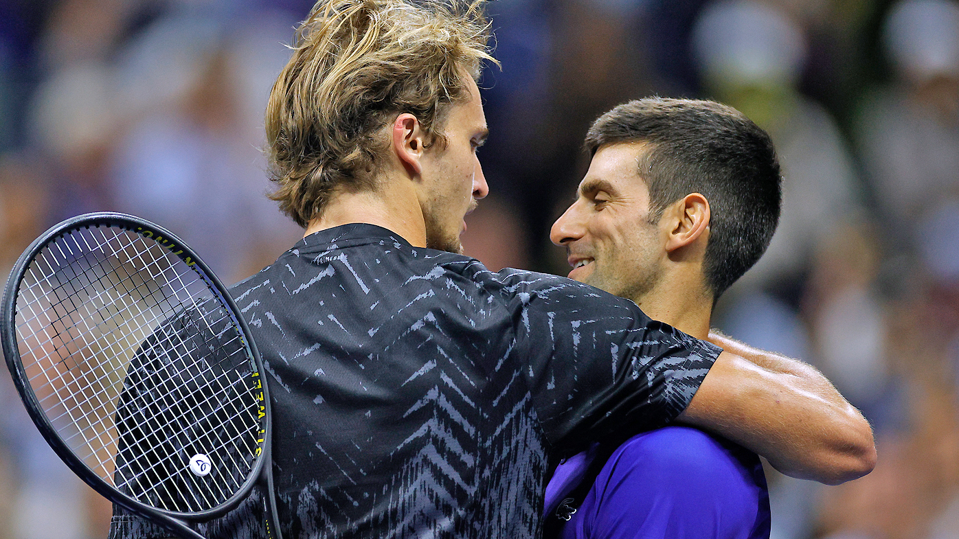 Alexander Zverev of Germany and Novak Djokovic of Serbia embrace