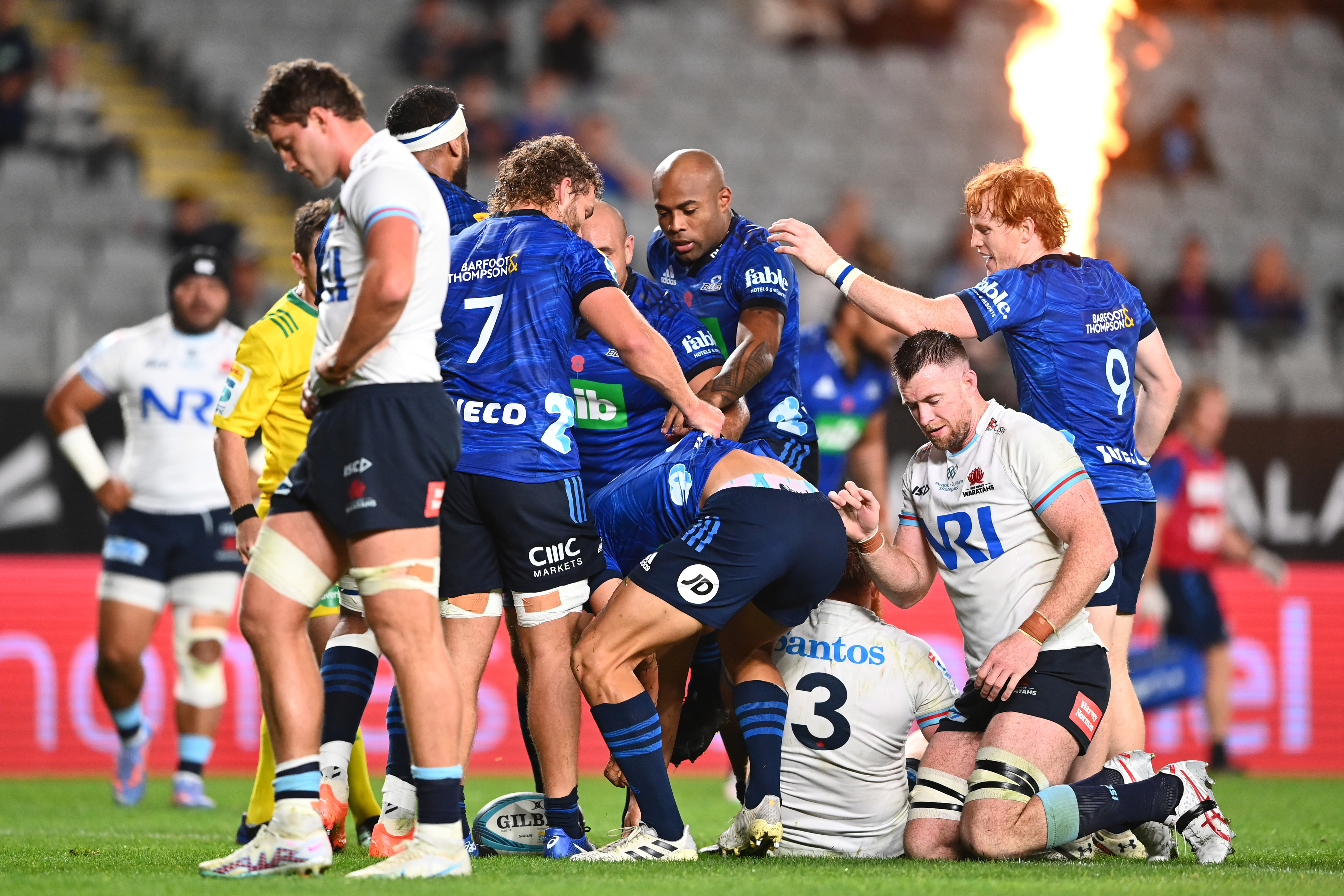Zarn Sullivan celebrates with his Blues teammates after scoring a try, leaving the Waratahs dejected.