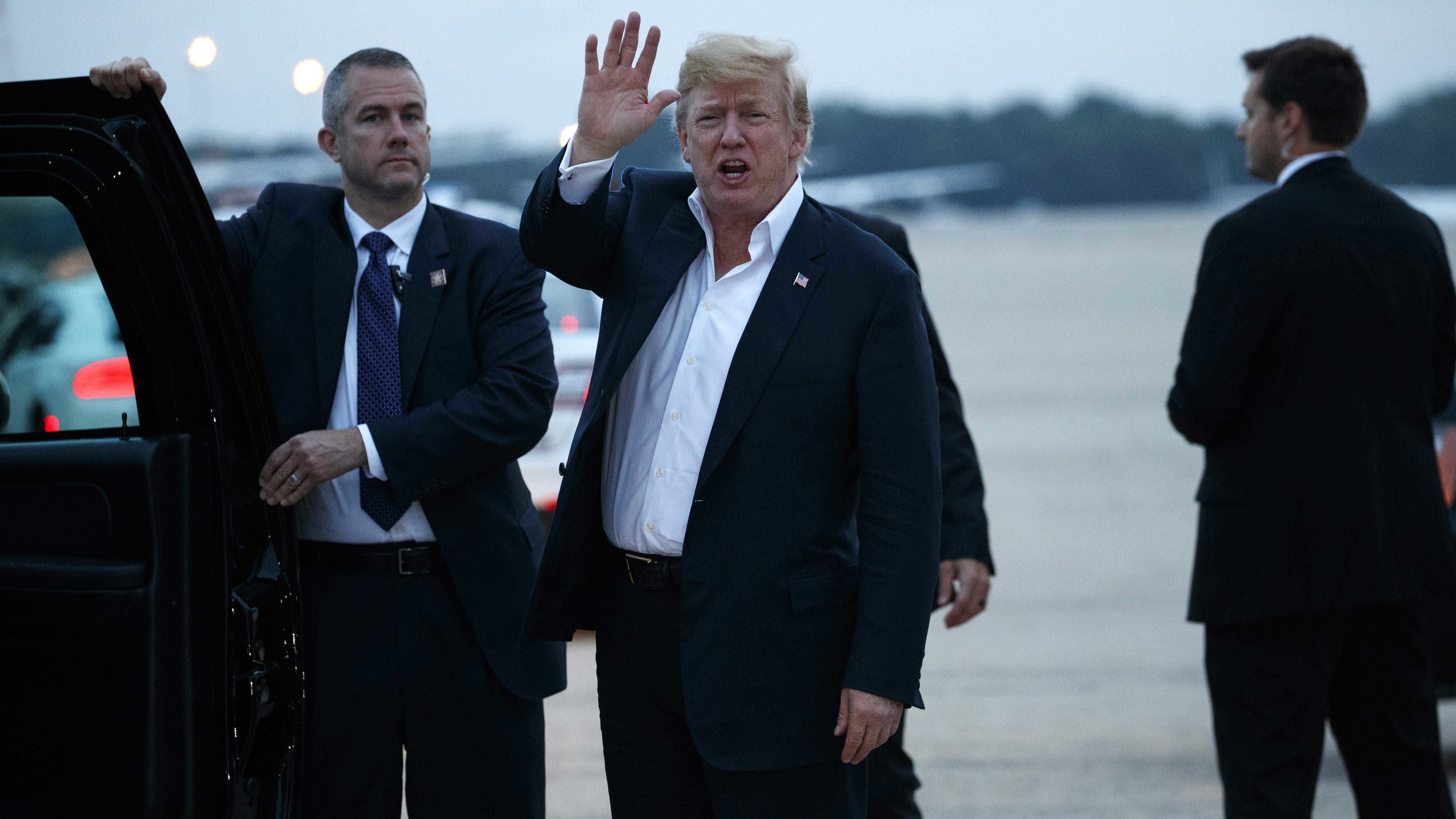 Then US President Donald Trump yells to reporters after arriving at Andrews Air Force Base after a summit with North Korean leader Kim Jong Un in Singapore, Wednesday, June 13, 2018, in Andrews Air Force Base.