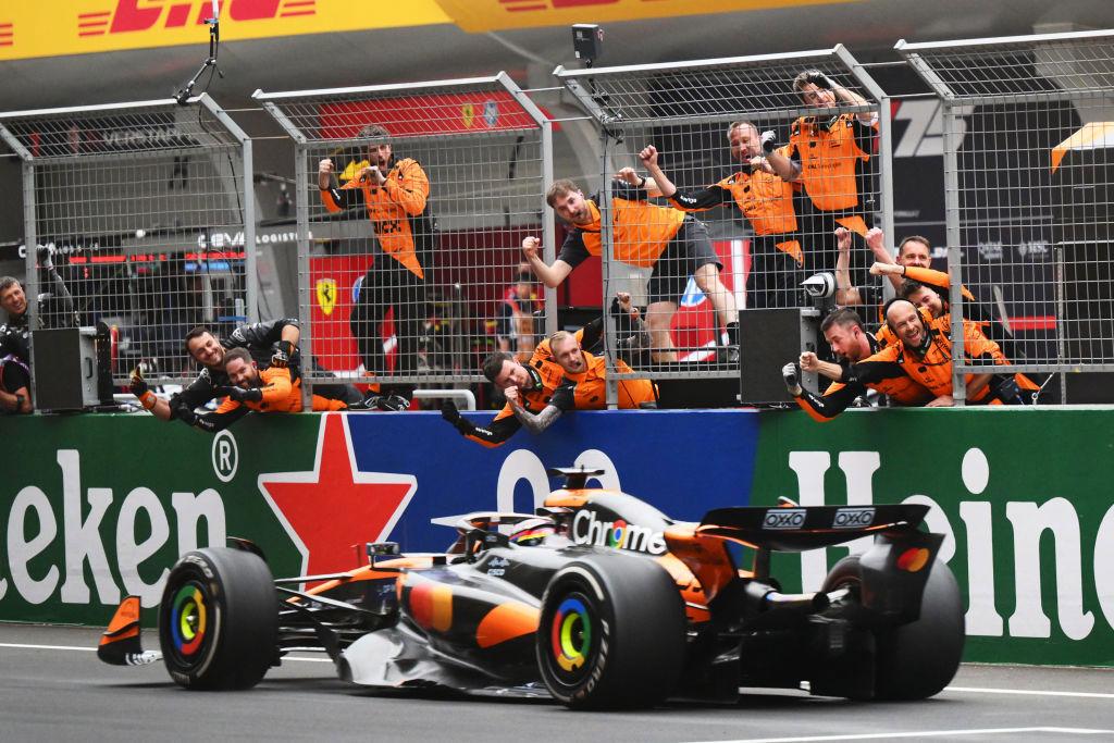 Race winner Oscar Piastri of Australia driving the (81) McLaren MCL39 Mercedes passes his team celebrating on the pitwall