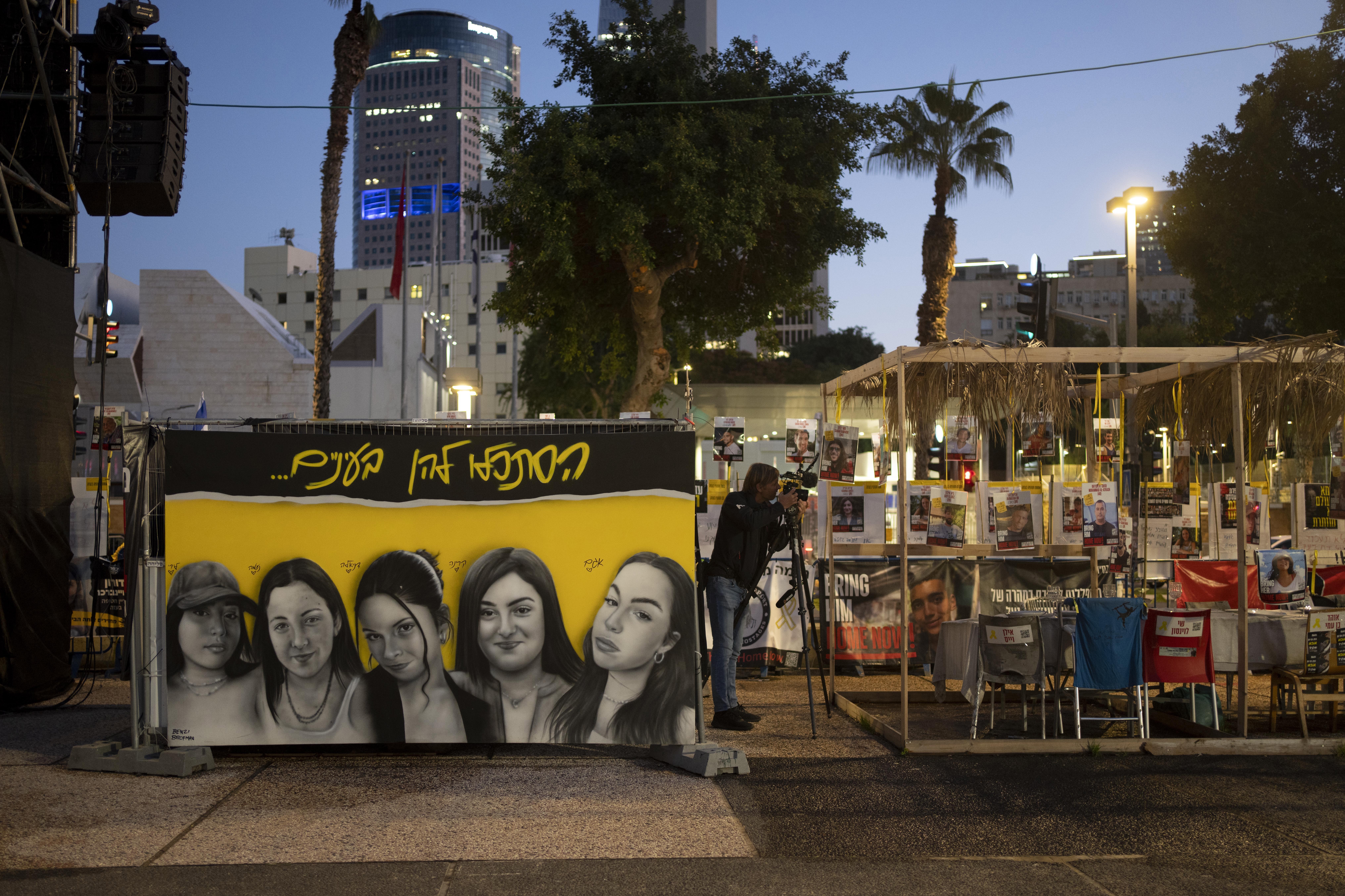 A mural of female Israeli soldiers held hostage by the Hamas militant group in the Gaza Strip is displayed in Tel Aviv, Israel, Friday, Jan. 24, 2025. (AP Photo/Maya Alleruzzo)