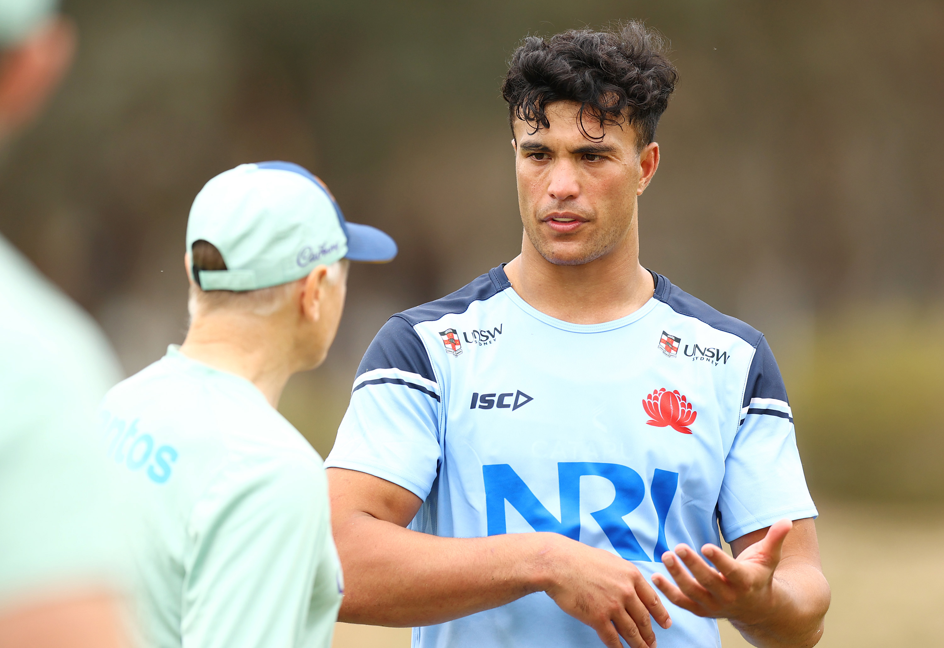 Joseph-Aukuso Suaalii talks to Wallabies coach Joe Schmidt at the AIS.