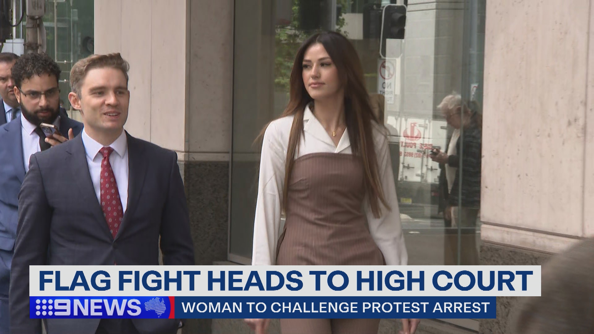 20-year-old Sarah Mouhanna walking to court.