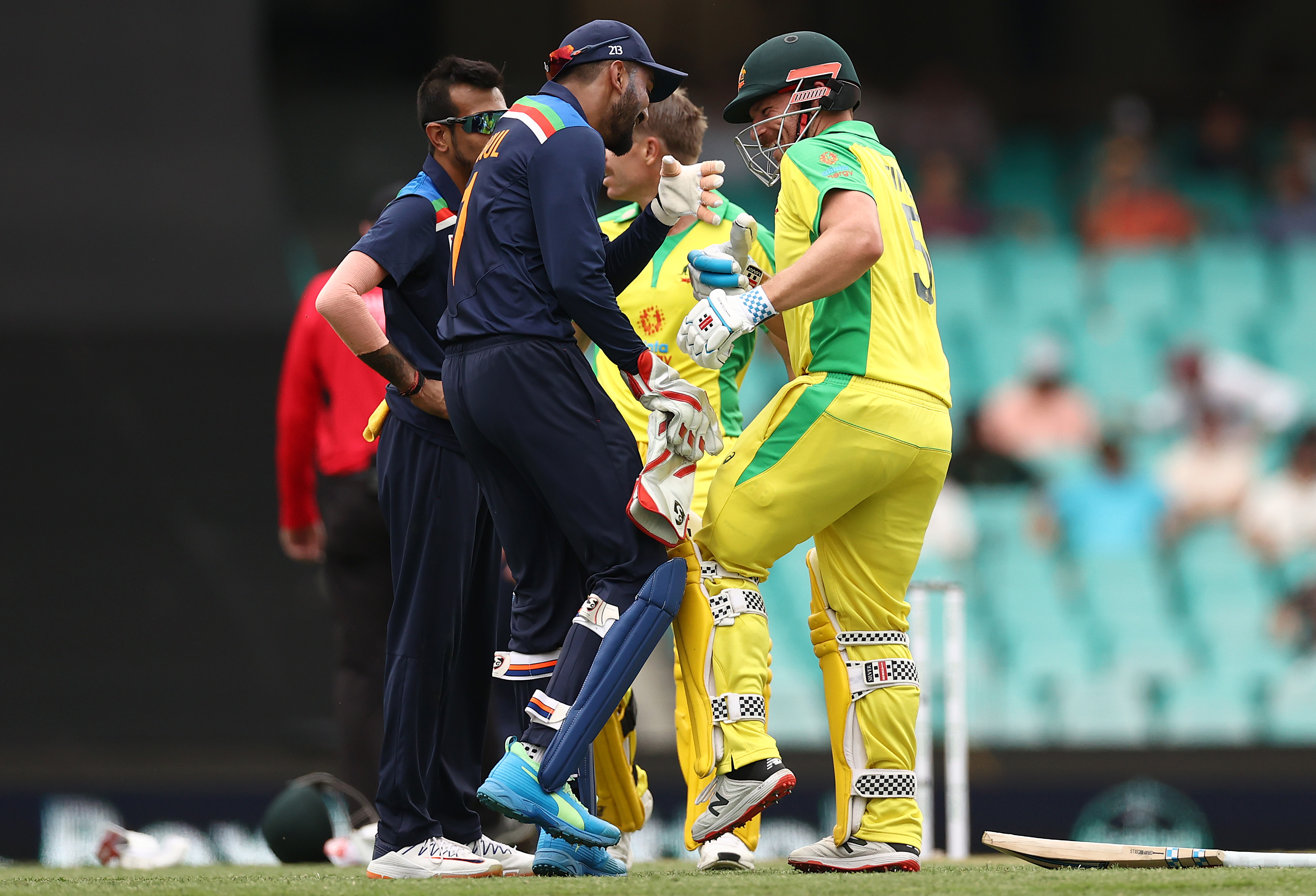 KL Rahul of India and Aaron Finch of Australia joke about.
