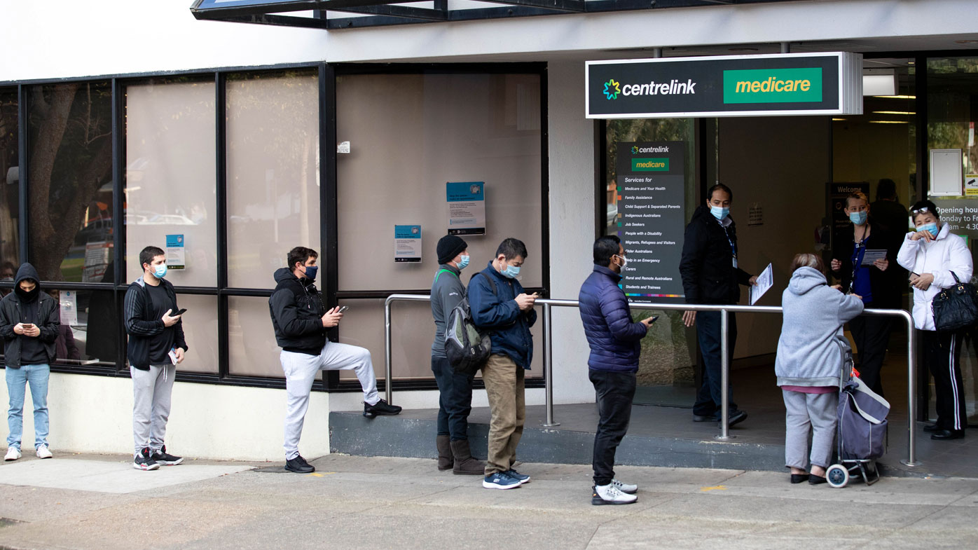The queue for Centrelink in Campsie stretches down the street