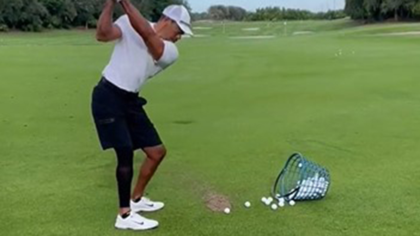 Tiger Woods has been seen swinging a golf club for the first time since his car accident.