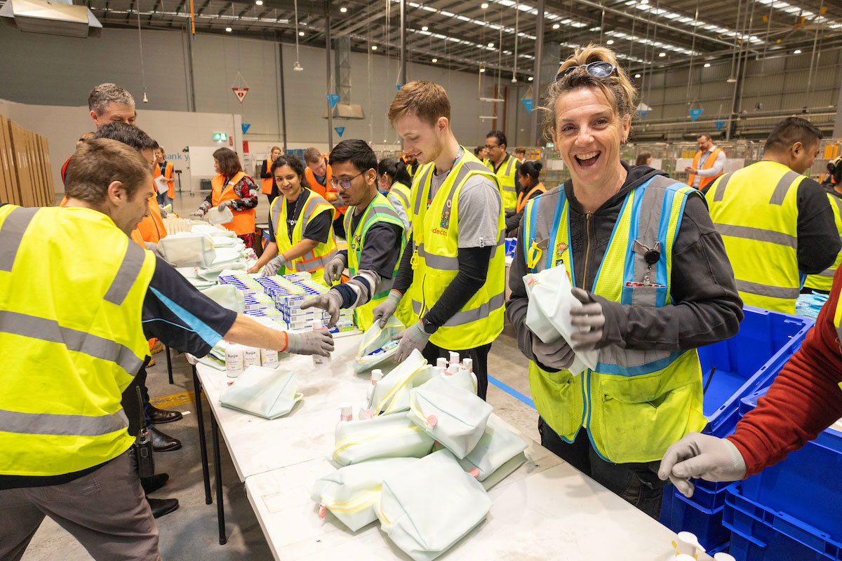 Amazon volunteers pack disaster relief packs at one of Australia's six hubs.