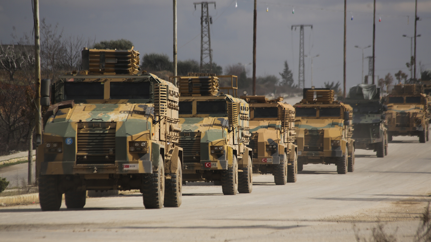 A Turkish military convoy drives in Idlib province.