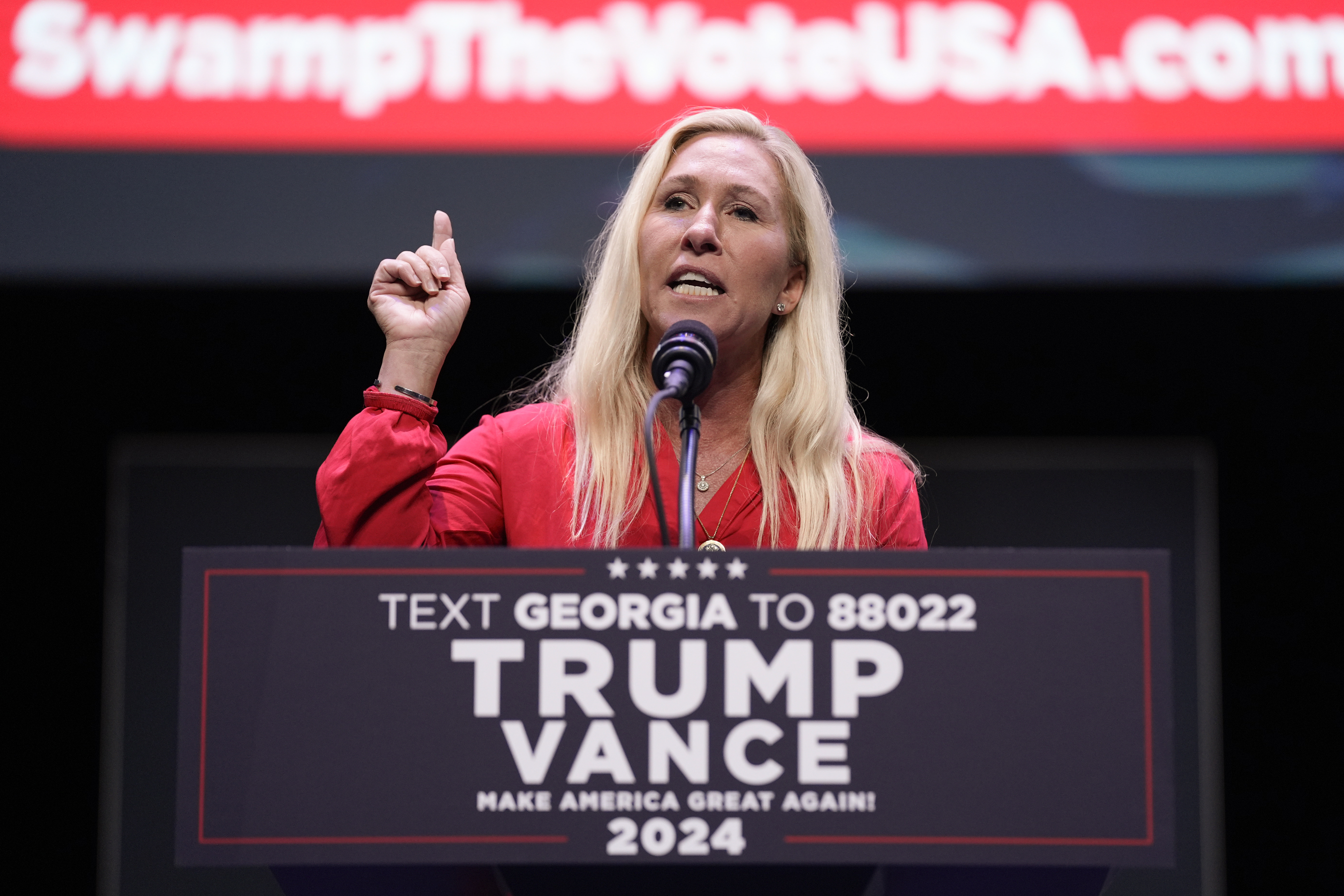Rep. Marjorie Taylor Greene, R-Ga., speaks before Republican presidential candidate former President Donald Trump arrives to deliver remarks on the tax code, and manufacturing at the Johnny Mercer Theatre Civic Center, Tuesday, Sept. 24, 2024, in Savannah, Ga.