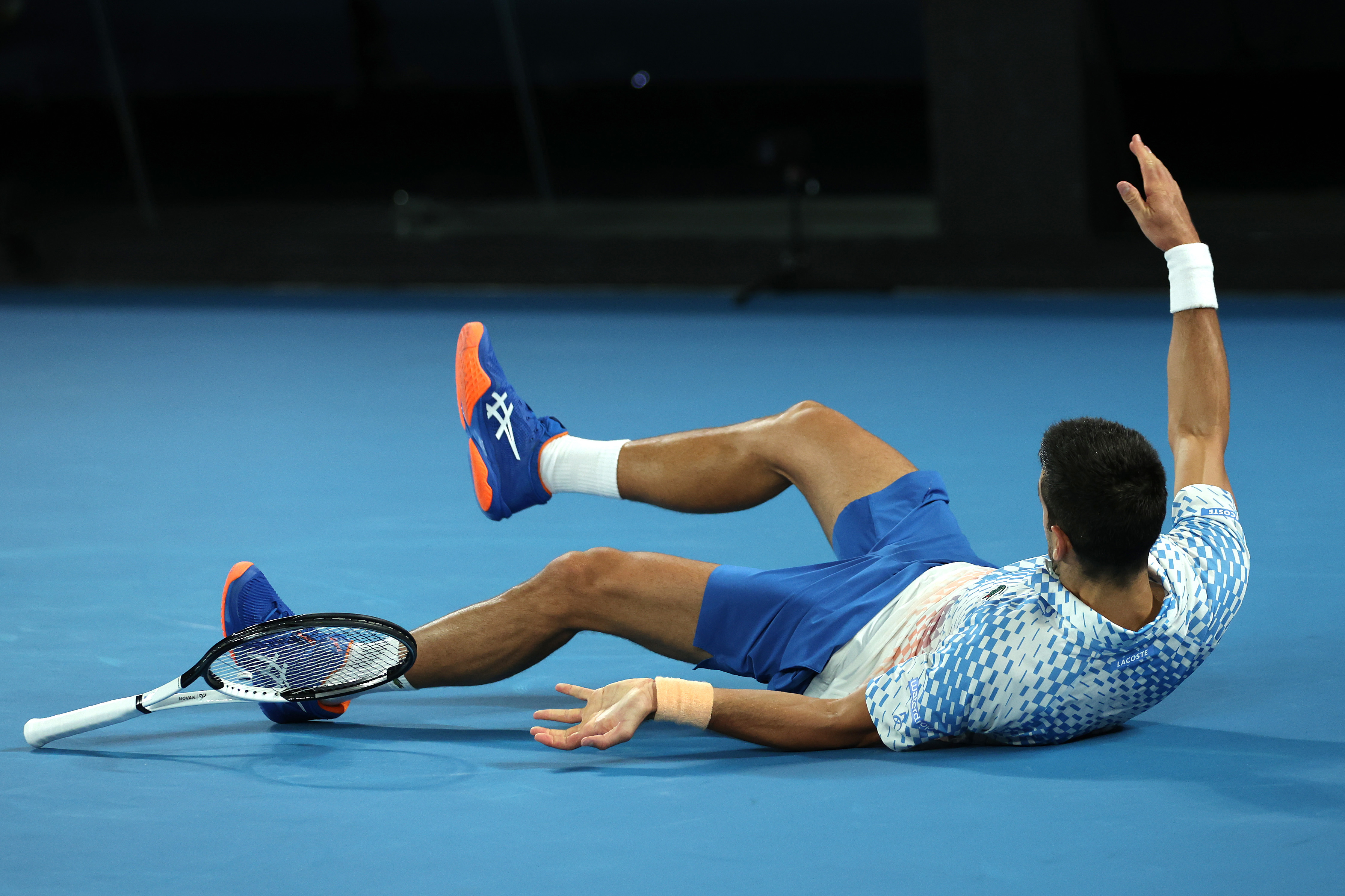 LIVE: Djokovic takes awkward tumble in final