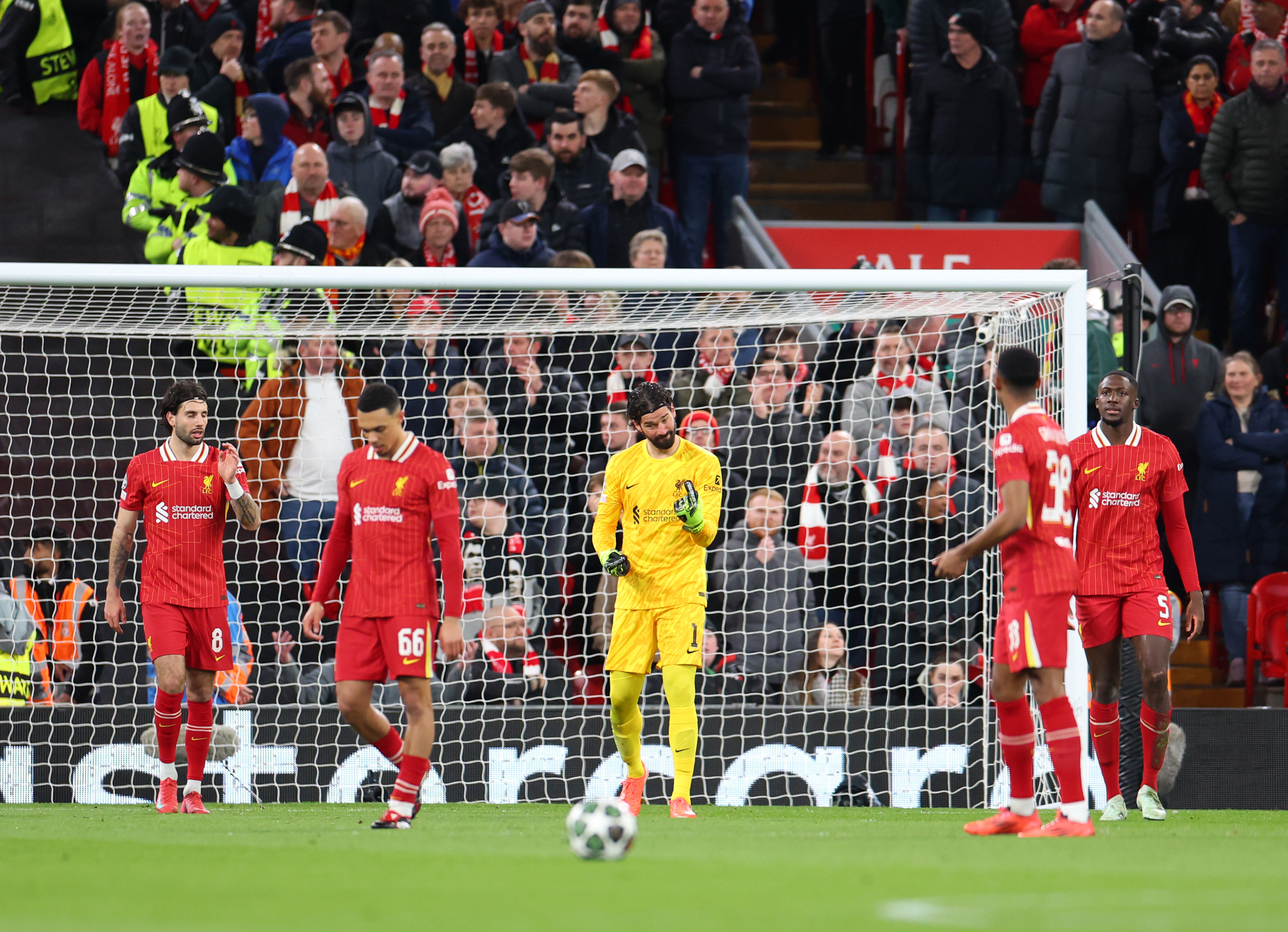 Alisson Becker of Liverpool reacts after Ousmane Dembele of Paris Saint-Germain scores.