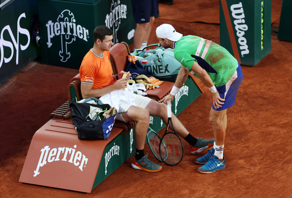 French Open 2024: Grigor Dimitrov speaks to Hubert Hurkacz during change over; Hubert Hurkacz V Grigor Dimitrov.