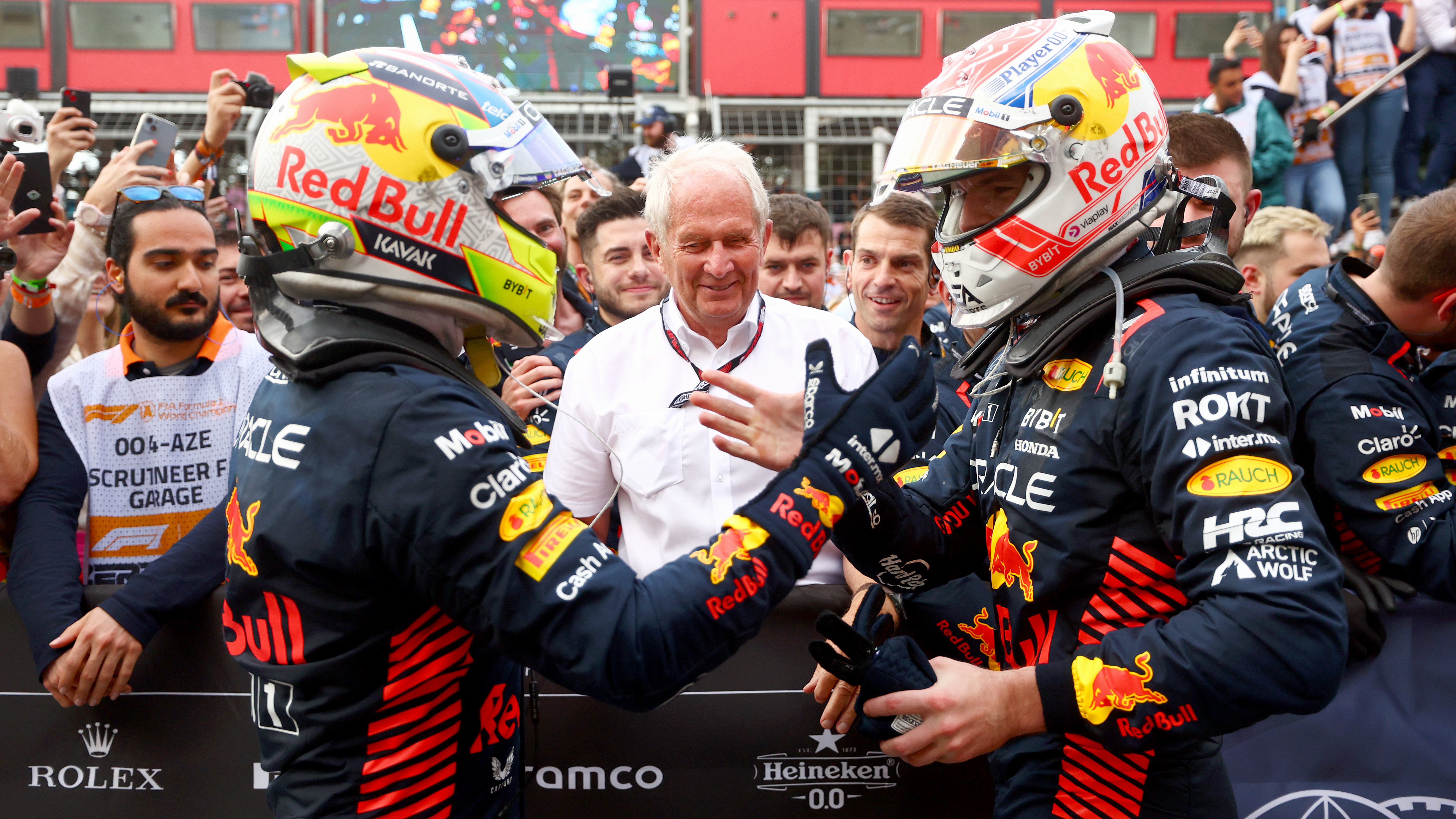 Race winner Sergio Perez of Mexico and Oracle Red Bull Racing and Second placed Max Verstappen of the Netherlands and Oracle Red Bull Racing celebrate with Red Bull Racing Team Consultant Dr Helmut Marko in parc ferme during the F1 Grand Prix of Azerbaijan at Baku City Circuit on April 30, 2023 in Baku, Azerbaijan. (Photo by Bryn Lennon - Formula 1/Formula 1 via Getty Images)
