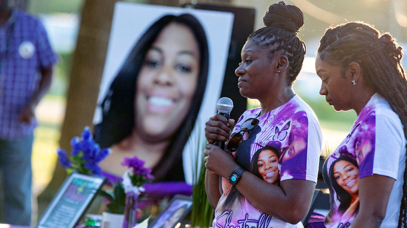 Mourners gather for a remembrance service for Ajike Owens