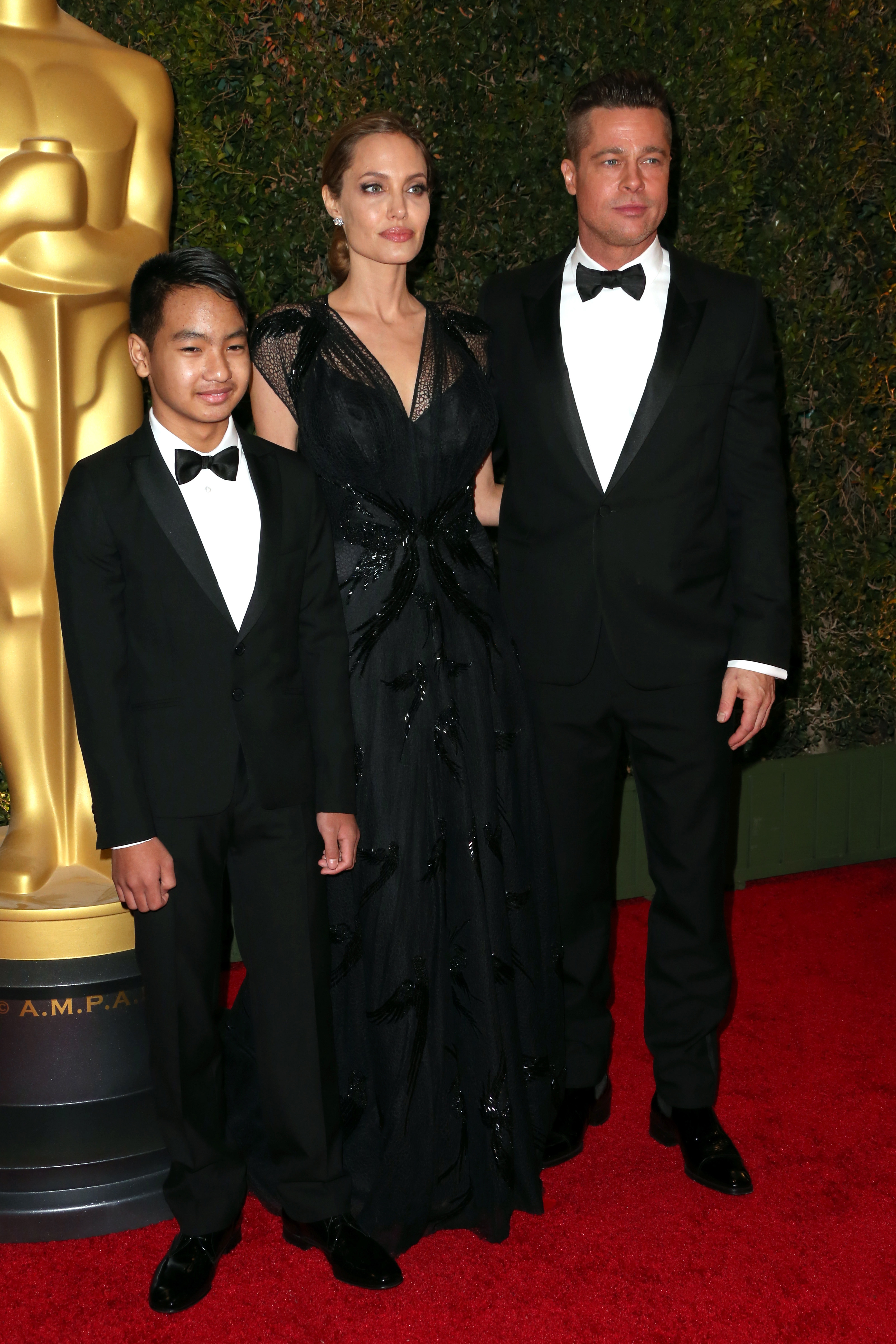 Maddox Jolie-Pitt with parents Angelina Jolie and Brad PItt at the Academy of Motion Picture Arts and Sciences' Governors Awards in November 2013.