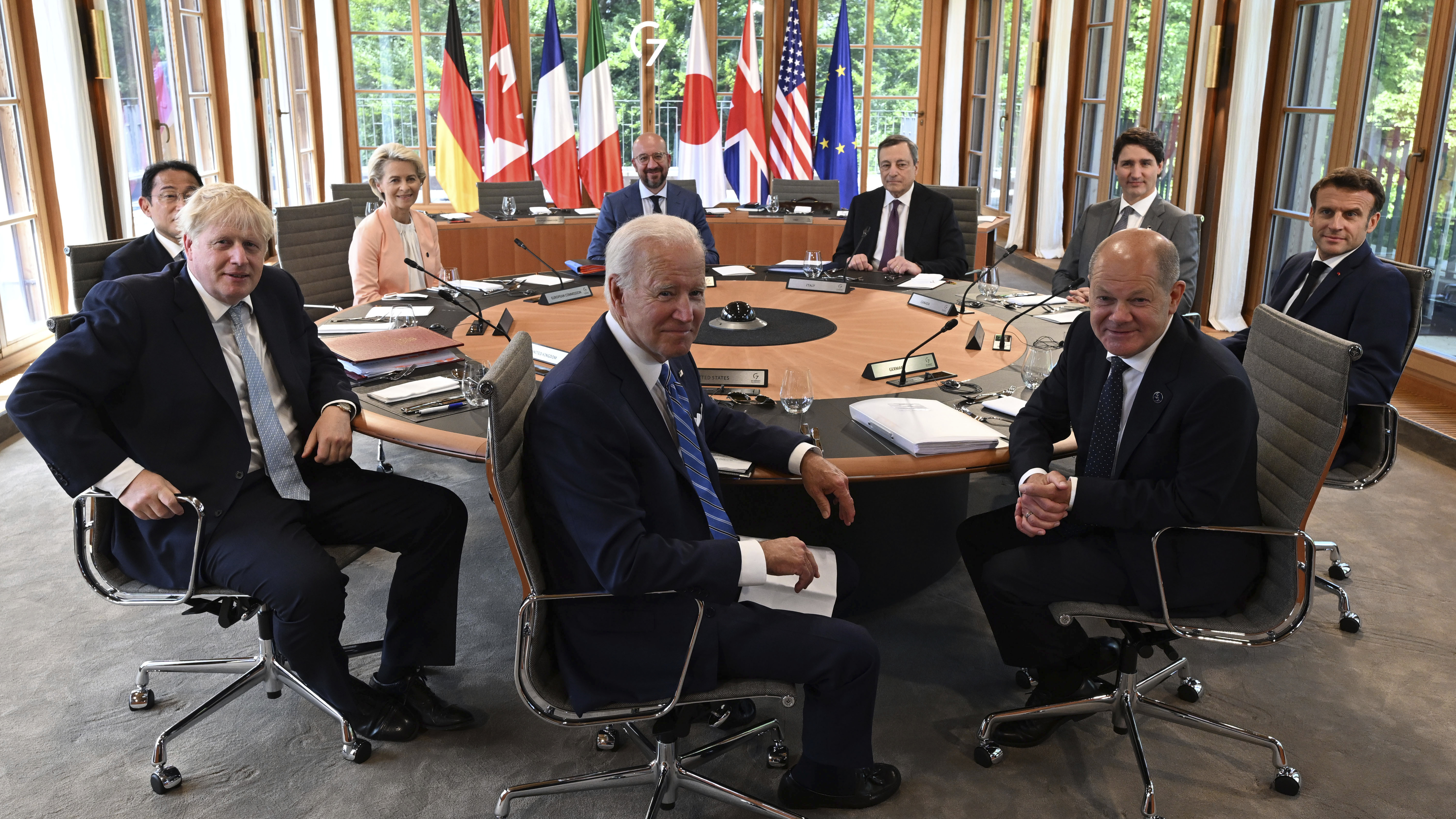 Clockwise from left, Fumio Kishida, Prime Minister of Japan, Ursula von der Leyen, President of the European Commission, Charles Michel, President of the European Council, Mario Draghi, Prime Minister of Italy, Justin Trudeau, Prime Minister of Canada, Emmanuel Macron, Prime Minister of France, German Chancellor Olaf Scholz, US President Joe Biden and Boris Johnson, Prime Minister of the United Kingdom sit at the first working session Castle Elmau in Kruen, near Garmisch-Partenkirchen, Germany, 