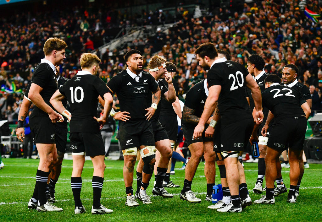 The All Blacks are dejected after a try to Malcolm Marx of the Springboks.