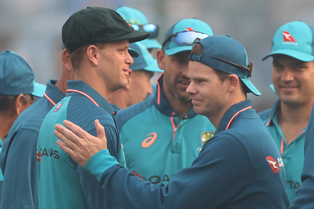 Matthew Kuhnemann is congratulated by Steve Smith after he was capped to play his first test match for Australia.