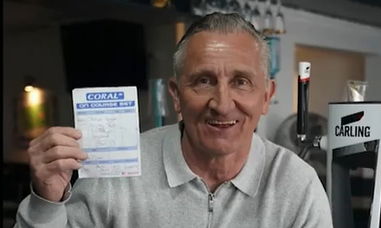 Tim Piper holds aloft the bet slip that won him $100,000.