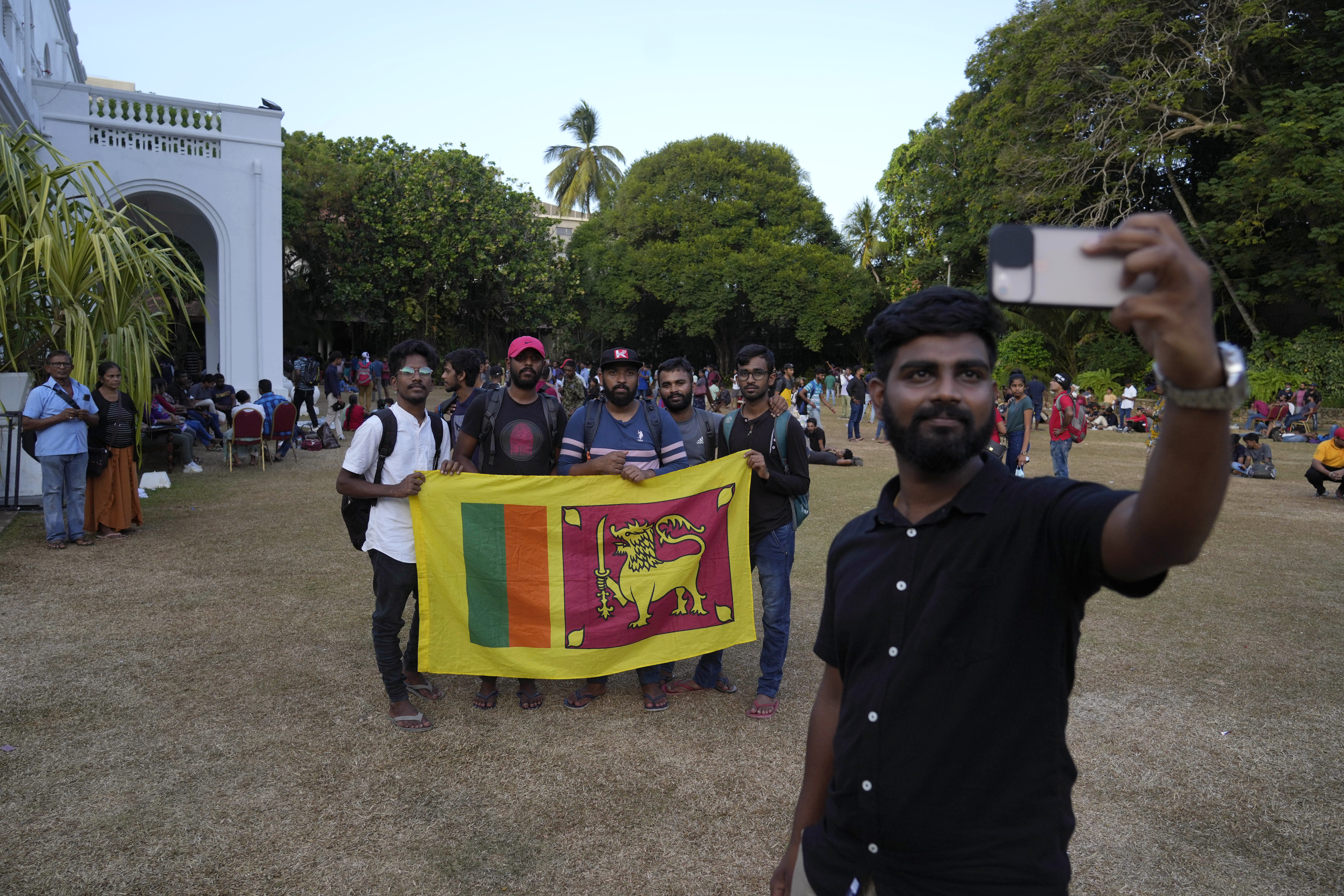 People take a selfie at the official residence of president Gotabaya Rajapaksa four days after it was stormed by anti-government protesters in Colombo.
