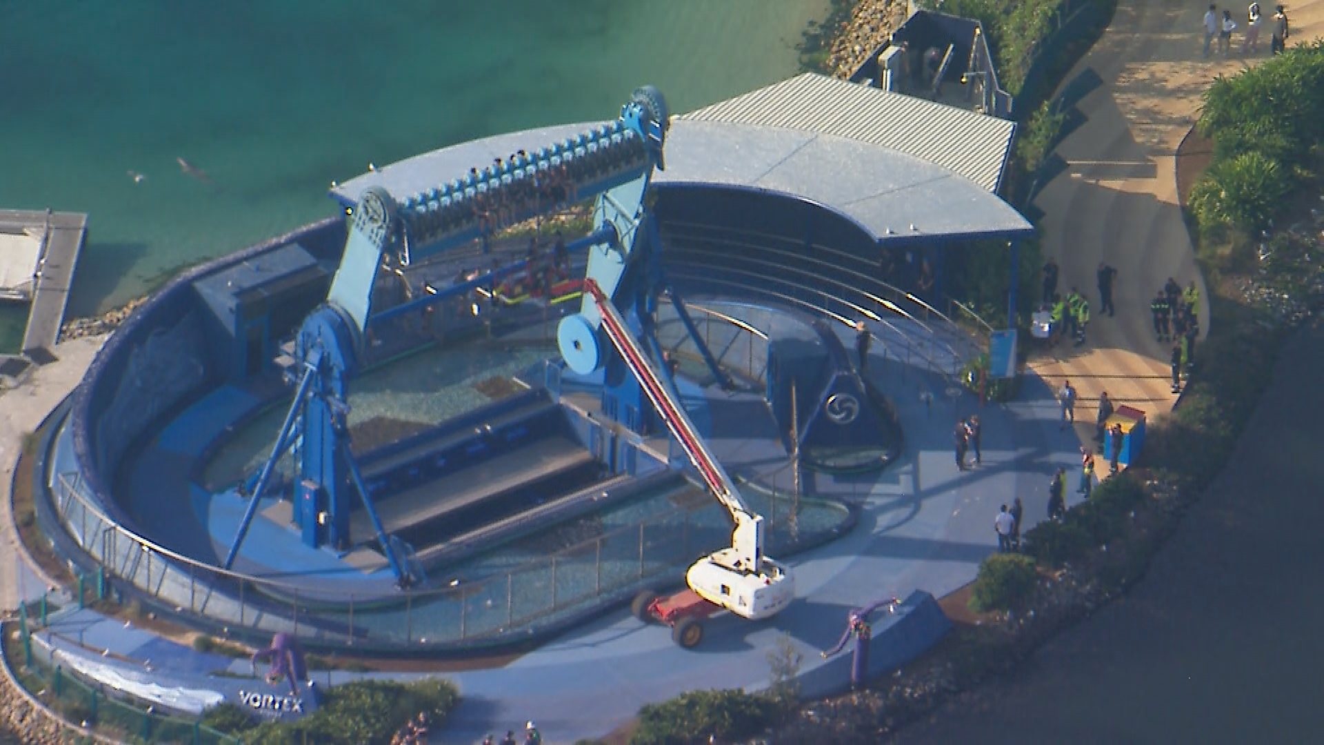 More than a dozen people are trapped on ride at Sea World on the Gold Coast, with staff at the theme park currently working to free them.